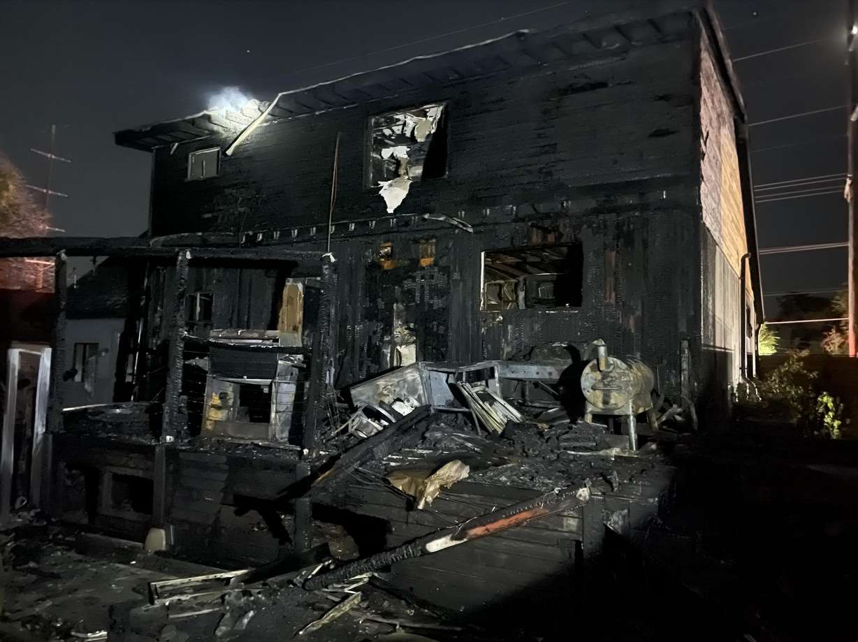 A home in Millcreek is pictured after it burned in a house fire just after midnight on Wednesday.