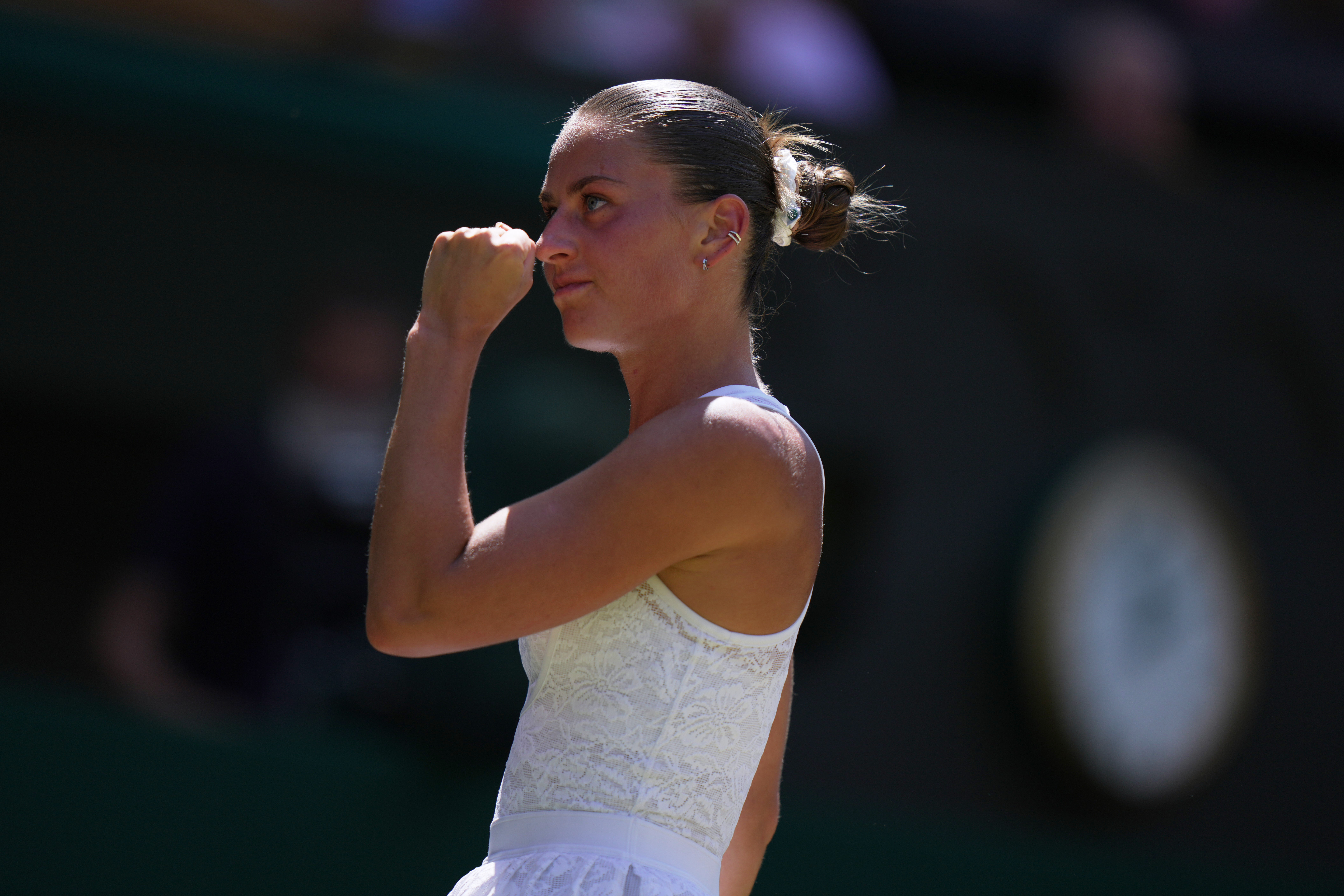 Marta Kostyuk of Ukraine celebrates a point against Jasmine Paolini of Italy, in their quarter-final women's singles match at the Wimbledon Tennis Championships in London, Wednesday, July 8, 2026. 