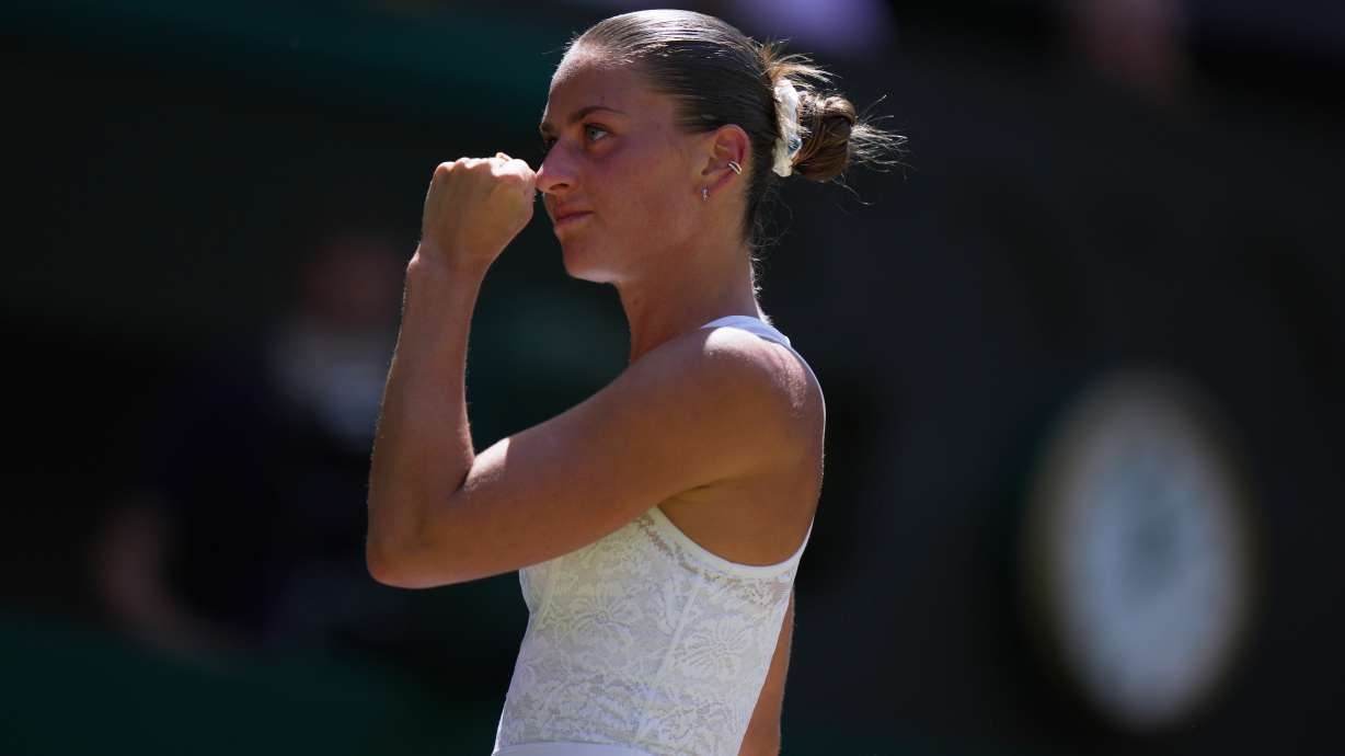 Marta Kostyuk of Ukraine celebrates a point against Jasmine Paolini of Italy, in their quarter-final women's singles match at the Wimbledon Tennis Championships in London, Wednesday, July 8, 2026.