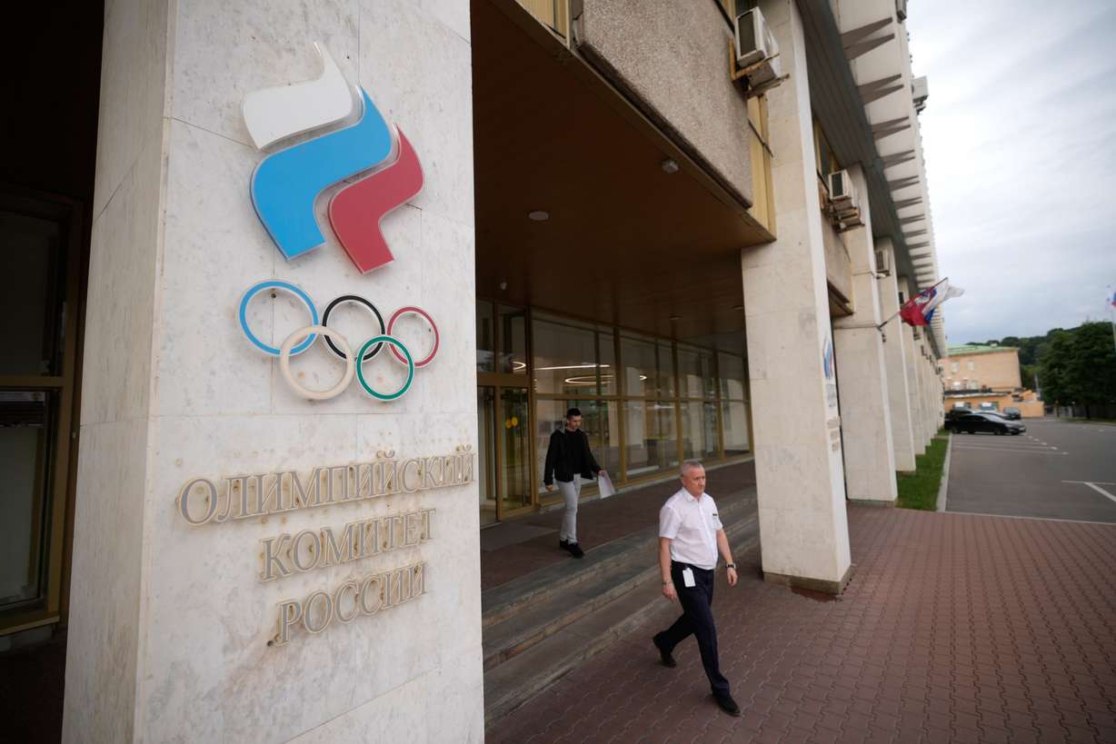 A man walks from the Russian National Olympic Committee building in Moscow, on Tuesday.
