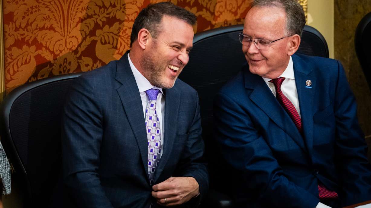 Senate President Stuart Adams, R-Layton, right, talks to House Speaker Mike Schultz, R-Hooper, left, at the Capitol in Salt Lake City on Jan. 22. Both leaders are backing away from plans to propose a constitutional amendment to address ballot initiatives this year.