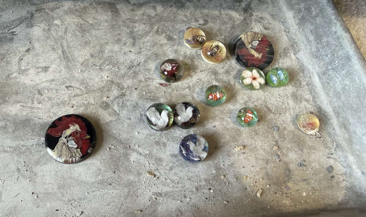 Glass artworks by Jodie McDougall are seen on a work table at the glass artist's home studio in Bountiful on June 24.