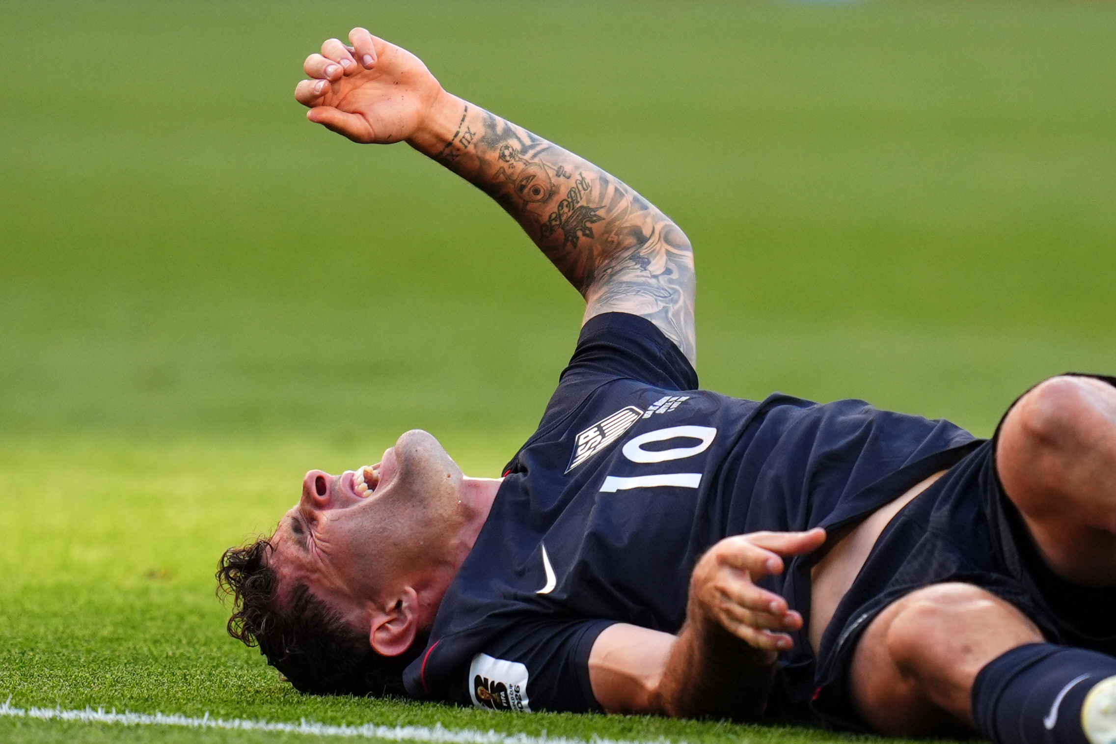 United States' Christian Pulisic (10) reacts after a challenge during the World Cup round of 16 soccer match in Seattle, Monday, July 6, 2026. 