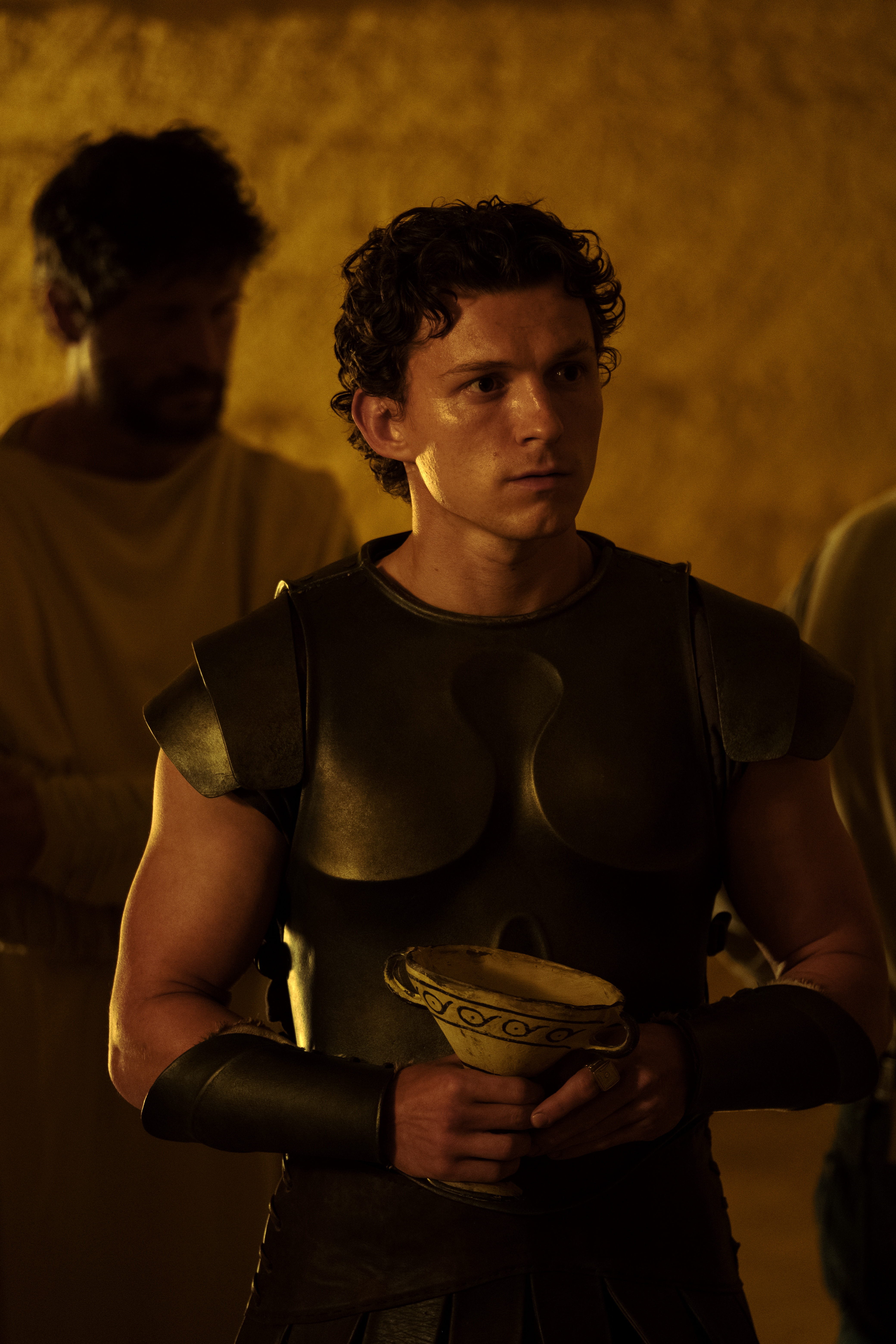 This image released by Universal Pictures shows Tom Holland is Telemachus in a scene from "The Odyssey."