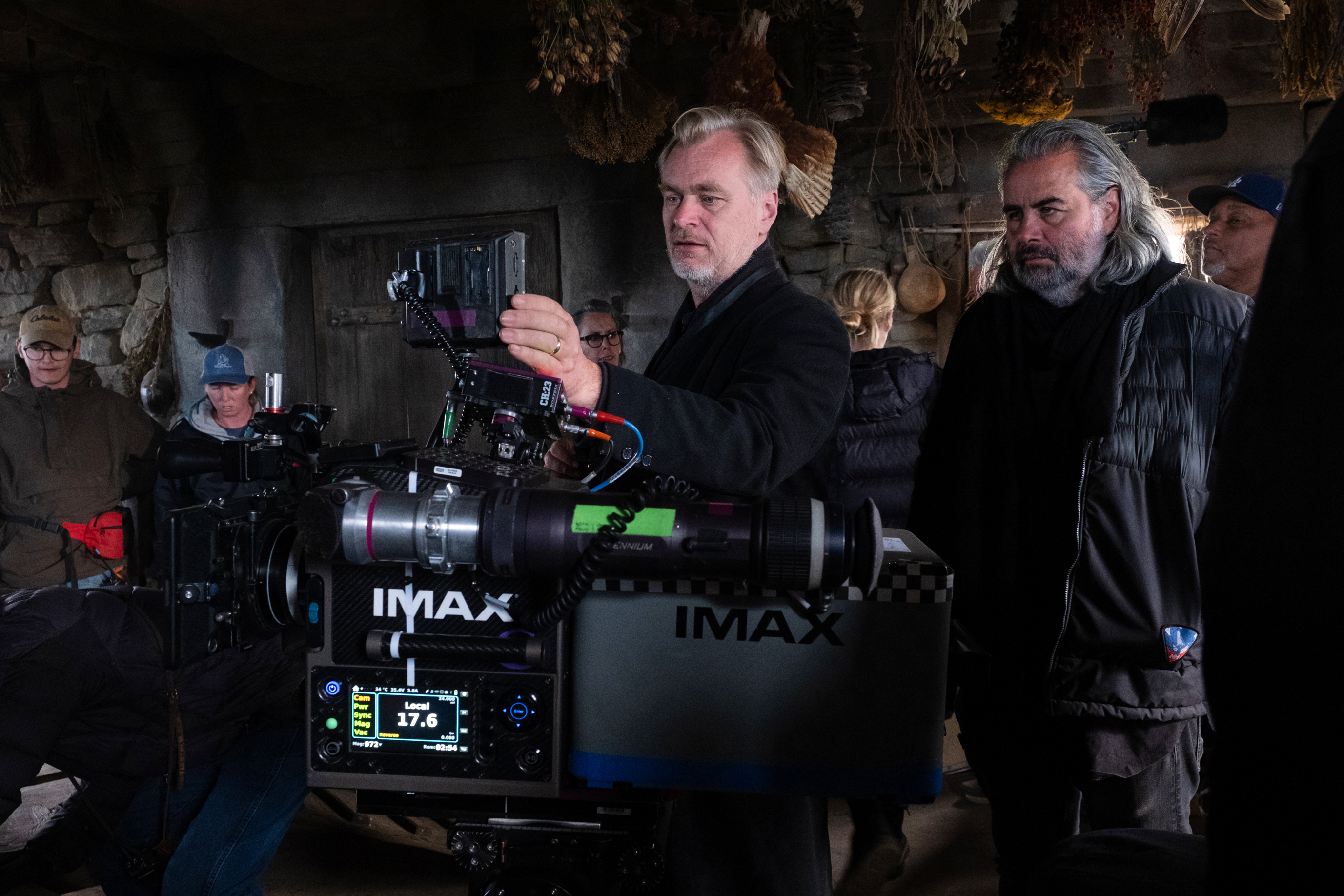 This image released by Universal Pictures shows director Christopher Nolan, center, with cinematographer Hoyte van Hoytema on set of "The Odyssey."