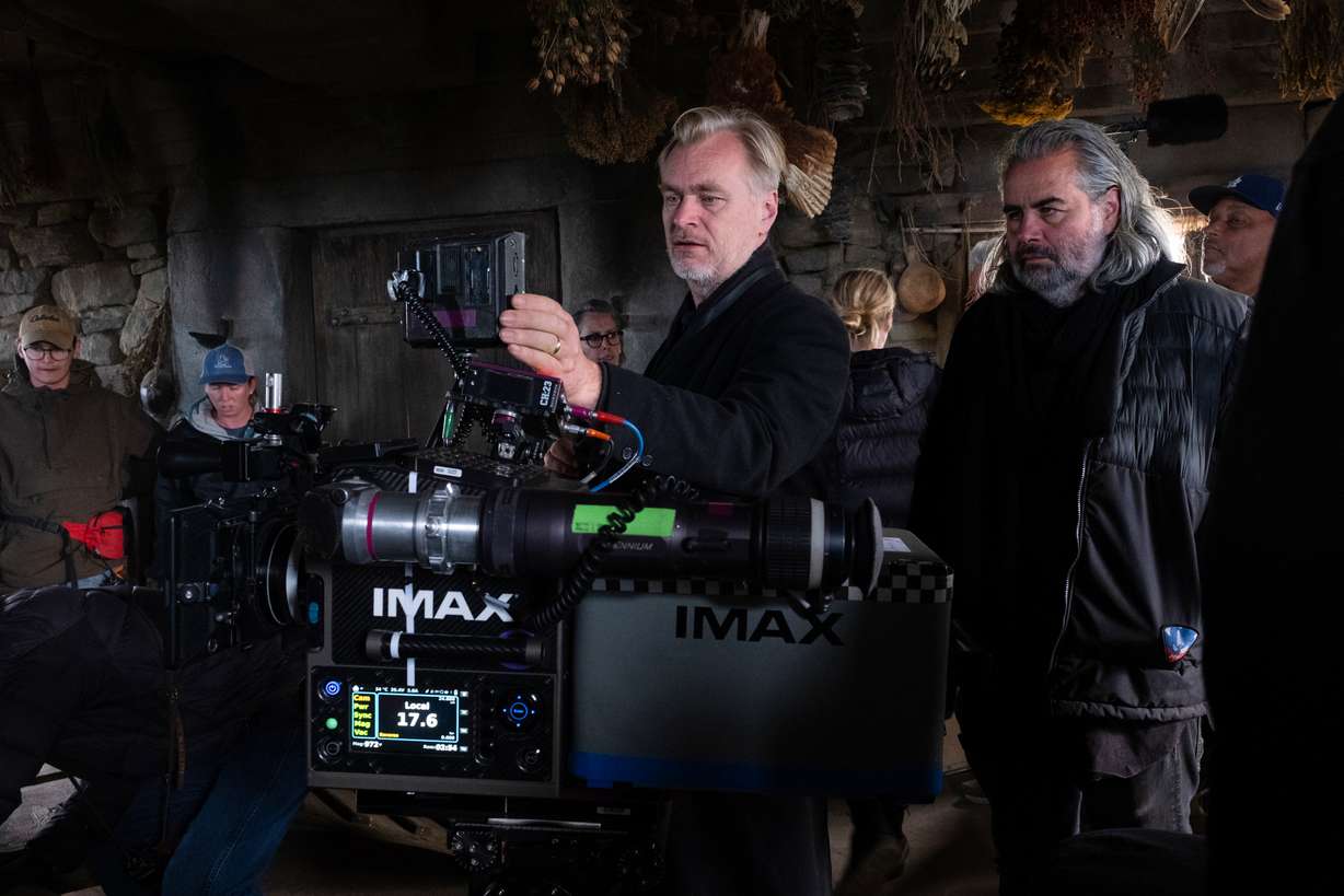 This image released by Universal Pictures shows director Christopher Nolan, center, with cinematographer Hoyte van Hoytema on set of "The Odyssey."