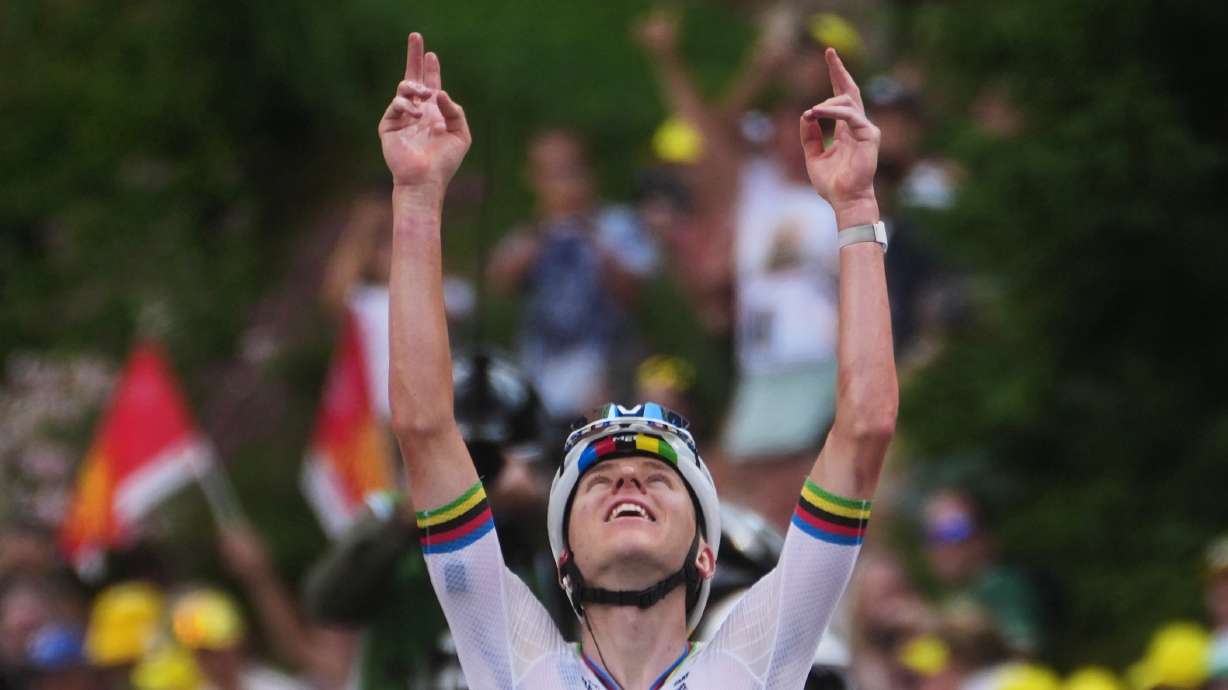 Slovenia's Tadej Pogacar celebrates as he crosses the finish line to win the sixth stage of the Tour de France cycling race with start in Pau and finish in Gavarnie-Gedre, France, Thursday, July 9, 2026.