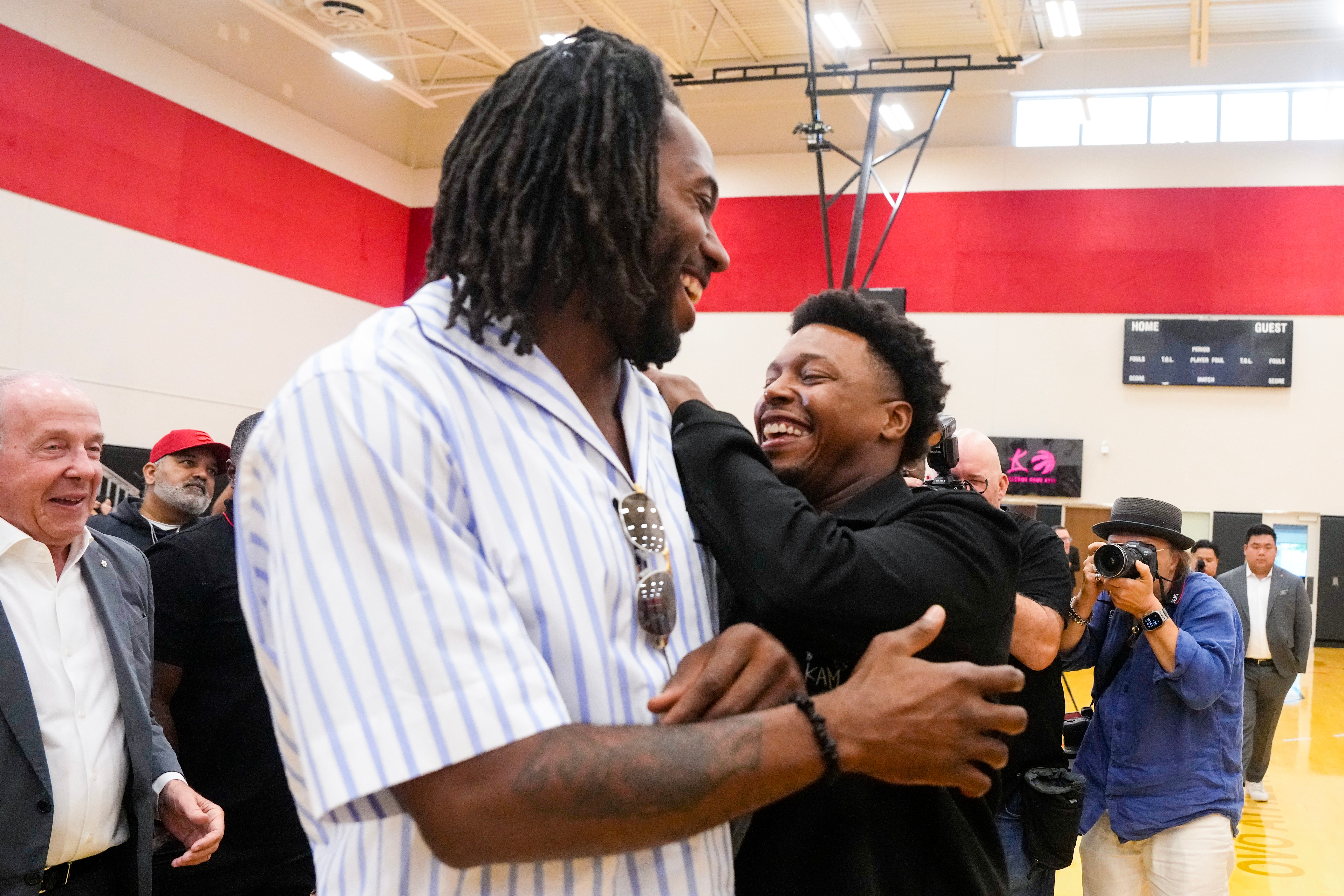 Kyle Lowry, right, speaks with Kawhi Leonard after a press conference in which Lowry signed a one-day contract to retire as a Toronto Raptor, in Toronto, on Tuesday, July 7, 2026. 