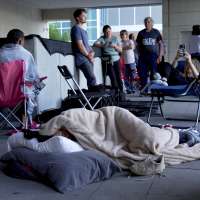 People camp outside court to get scarce public seats in hearing on Charlie Kirk's killing