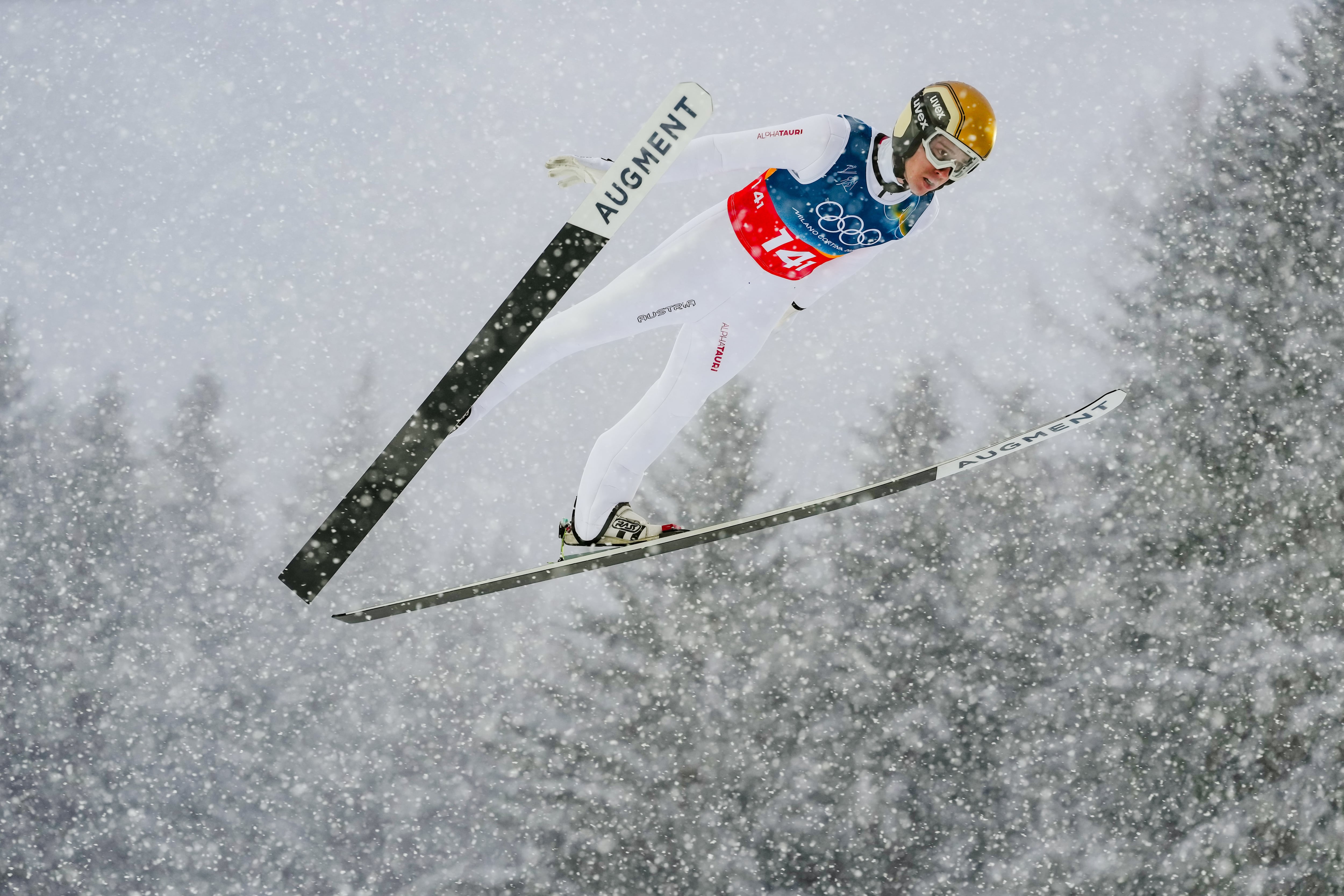 Stefan Rettenegger, of Austria, soars through the air during the Nordic combined team sprint at the 2026 Winter Olympics, in Predazzo, Italy, Feb. 19.