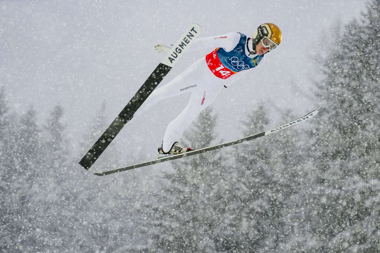 Stefan Rettenegger, of Austria, soars through the air during the Nordic combined team sprint at the 2026 Winter Olympics, in Predazzo, Italy, Feb. 19.