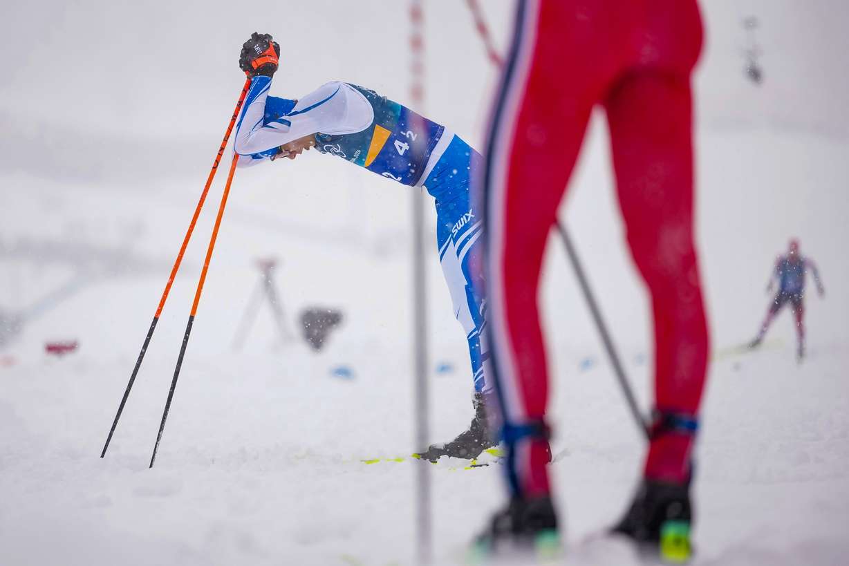 Eero Hirvonen, of Finland, reacts after crossing the finish line to win the silver medal in the nordic combined team sprint at the 2026 Winter Olympics, in Tesero, Italy, Feb. 19.