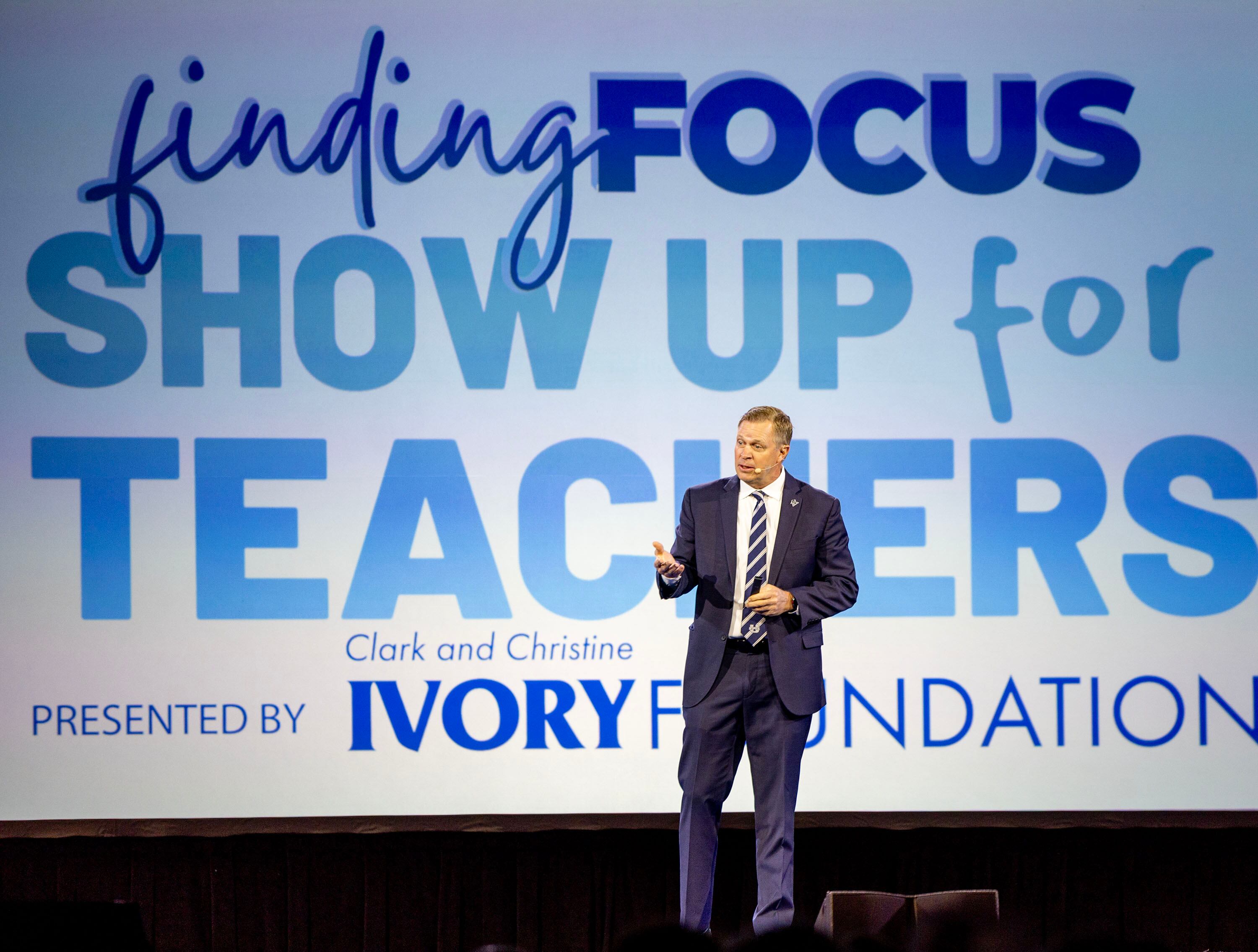 Bronco Mendenhall, head football coach at Utah State University, speaks at the Show Up for Teachers/Educator Wellness Conference at the Mountain America Exposition Center in Sandy on Thursday.