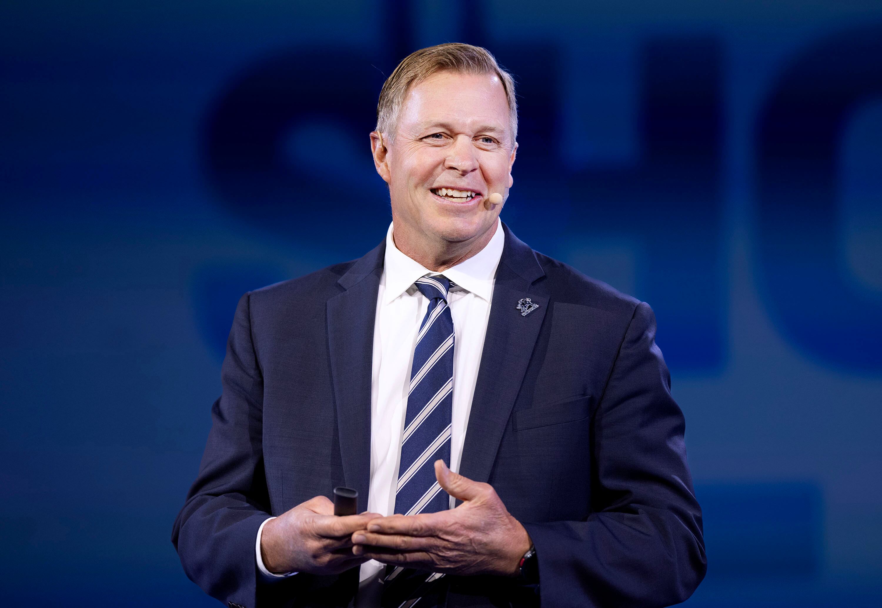 Bronco Mendenhall, head football coach at Utah State University, speaks at the Show Up for Teachers/Educator Wellness Conference at the Mountain America Exposition Center in Sandy on Thursday.