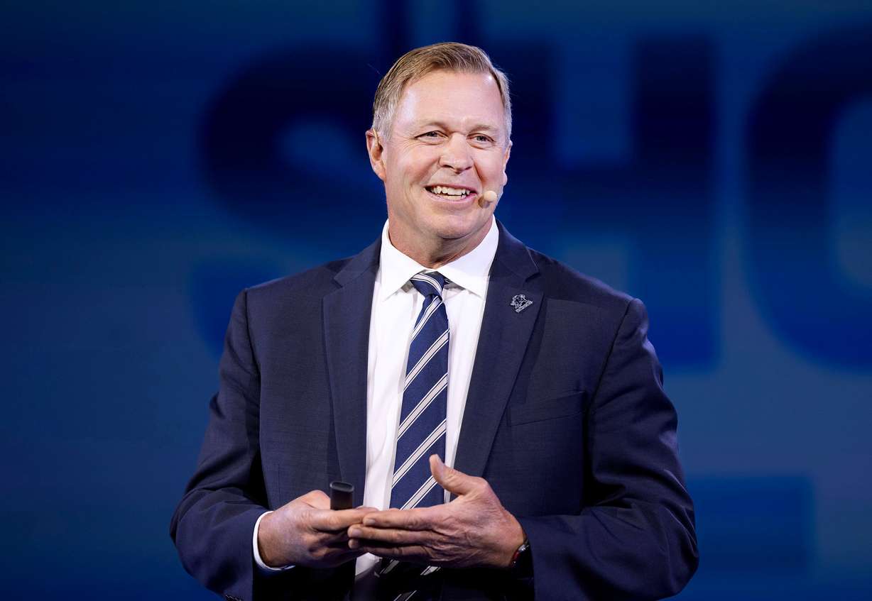 Bronco Mendenhall, head football coach at Utah State University, speaks at the Show Up for Teachers/Educator Wellness Conference at the Mountain America Exposition Center in Sandy on Thursday.