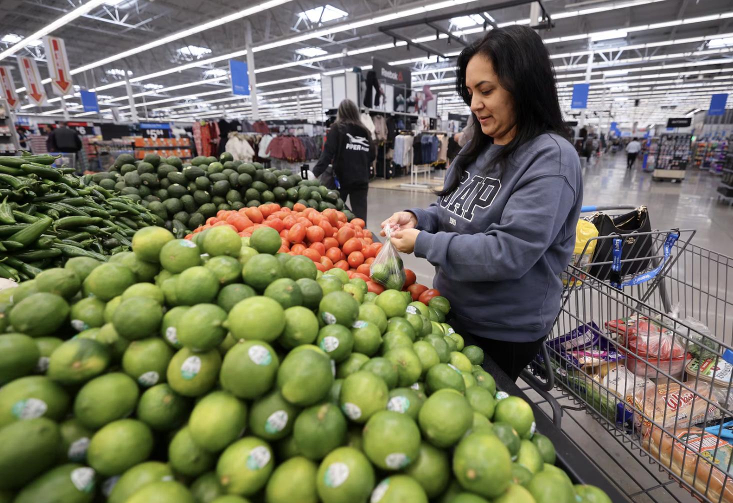 Andrea Cordova shops for limes at a Walmart Supercenter in West Valley City on Oct. 31, 2025.