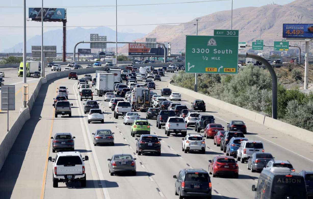 Traffic moves along I-15 in South Salt Lake during rush hour on June 29.