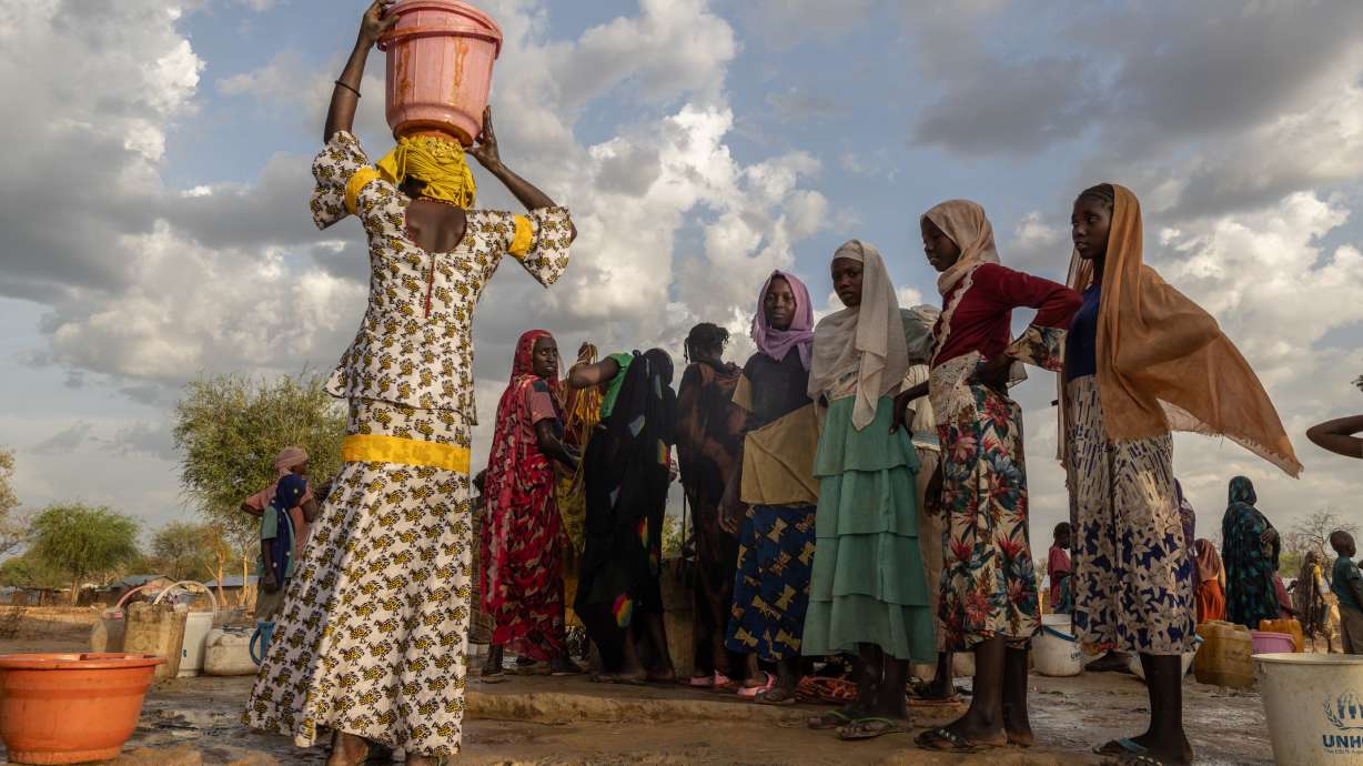 Women and children fetch water at dusk in the Korsi Refugee Camp in Birao, the Central African Republic, March 27. At least 1 million women have lost access to humanitarian and other critical support as a result of budget cuts over the last 18 months.