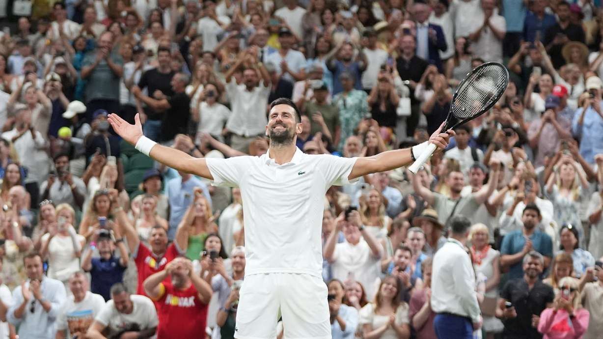 Novak Djokovic of Serbia celebrates winning against Felix Auger-Aliassime of Canada in their quarter-final men's singles match at the Wimbledon Tennis Championships in London, Tuesday, July 7, 2026.
