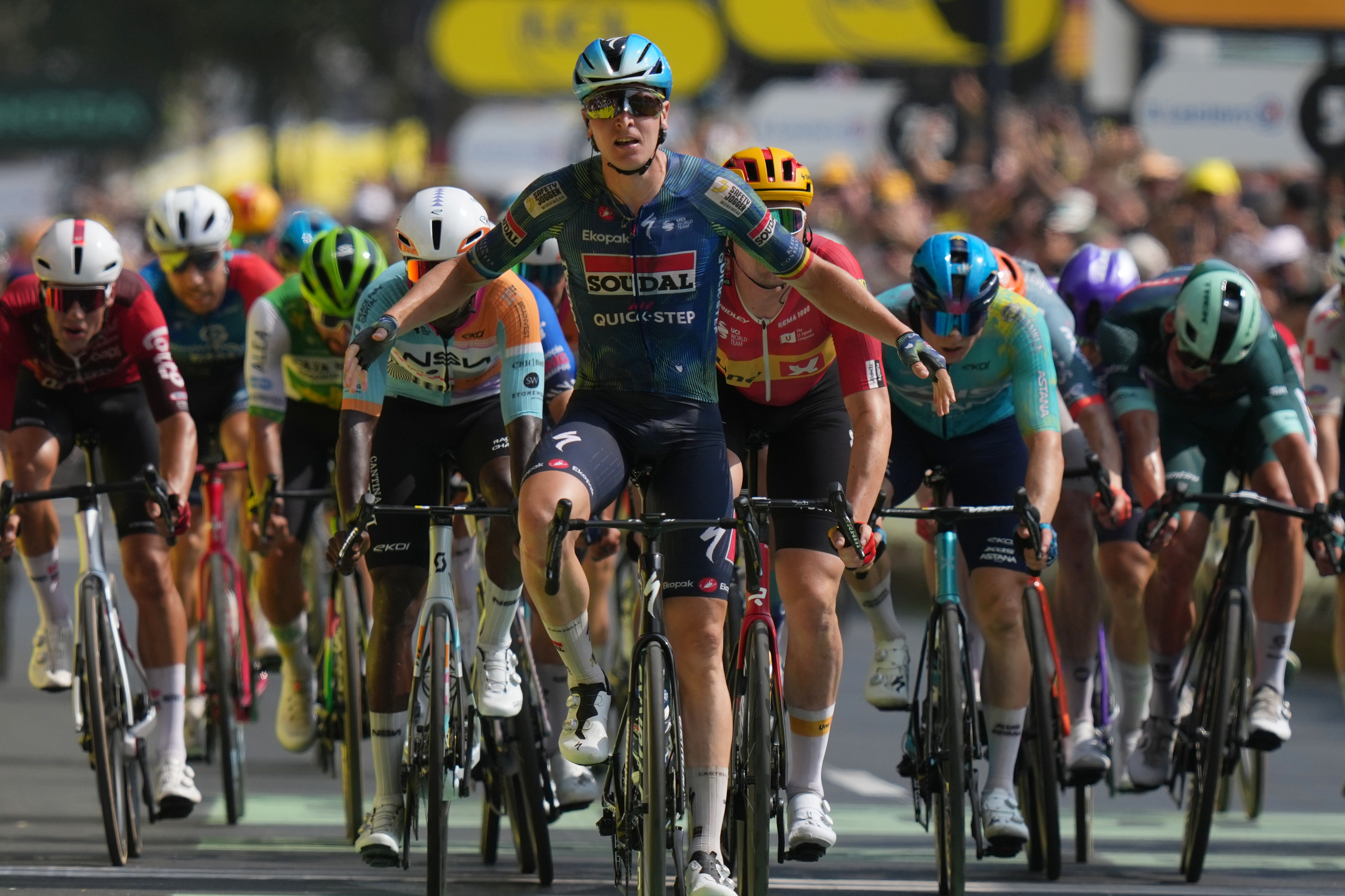 Belgium's Tim Merlier celebrates as he crosses the finish line to win the seventh stage of the Tour de France cycling race with start in Hagetmau and finish in Bordeaux, France, Friday, July 10, 2026. 