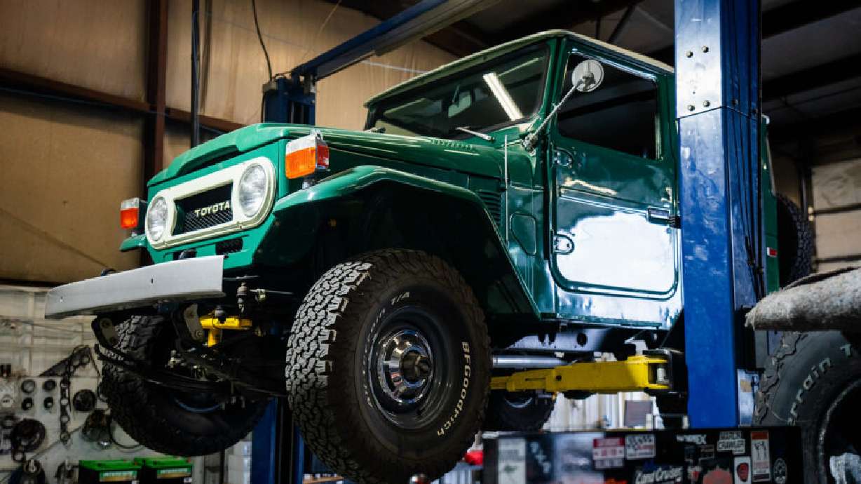 An early model Toyota Land Cruiser inside State Automotive's shop in Midvale.