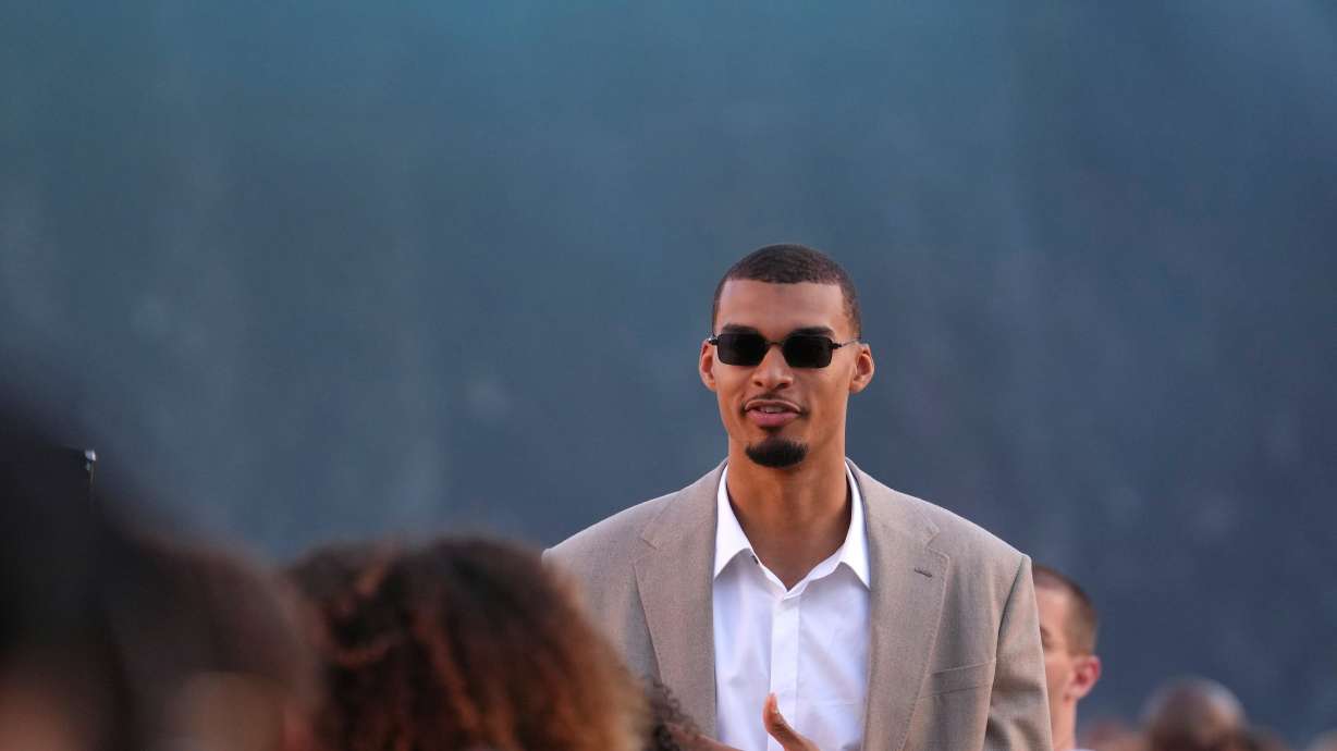 Victor Wembanyama arrives for the Louis Vuitton men's Spring Summer 2027 collection presented in Paris, France, Tuesday, June 23, 2026.