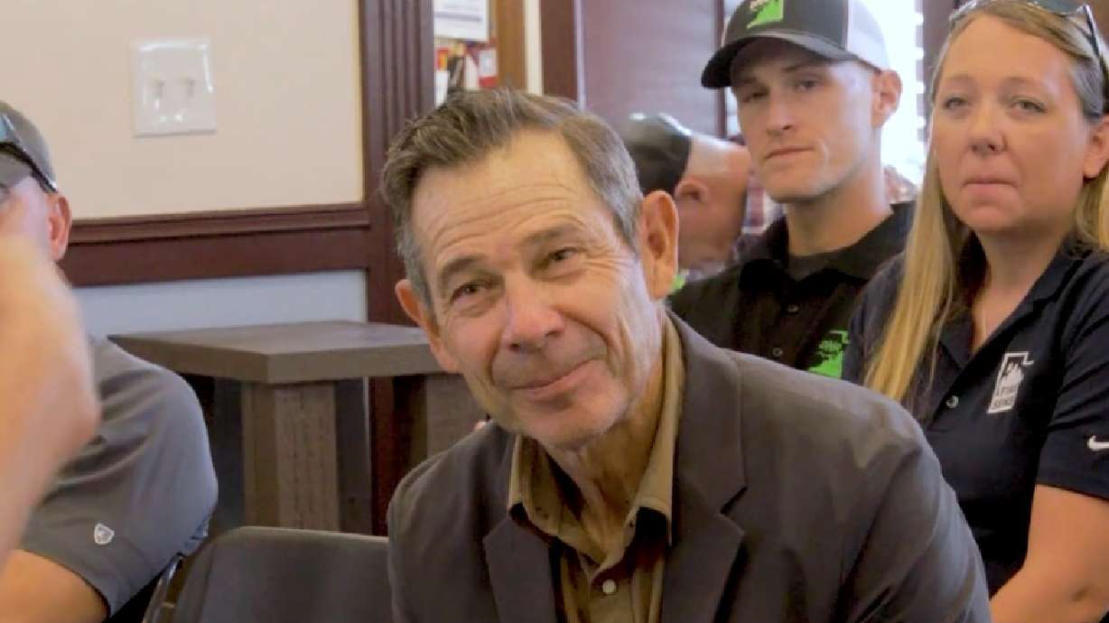 Utah Sen. John Curtis meets with state and federal land management agencies during a tour of fires near Eureka, Juab County, on Friday. He renewed calls for forest management after touring the area.