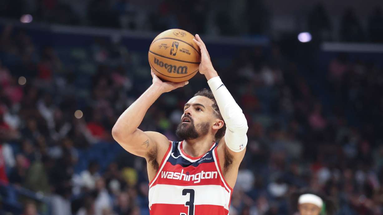 FILE - Washington Wizards guard Trae Young attempts a technical foul free throw against the New Orleans Pelicans in the second half of an NBA basketball game in New Orleans, March 8, 2026.
