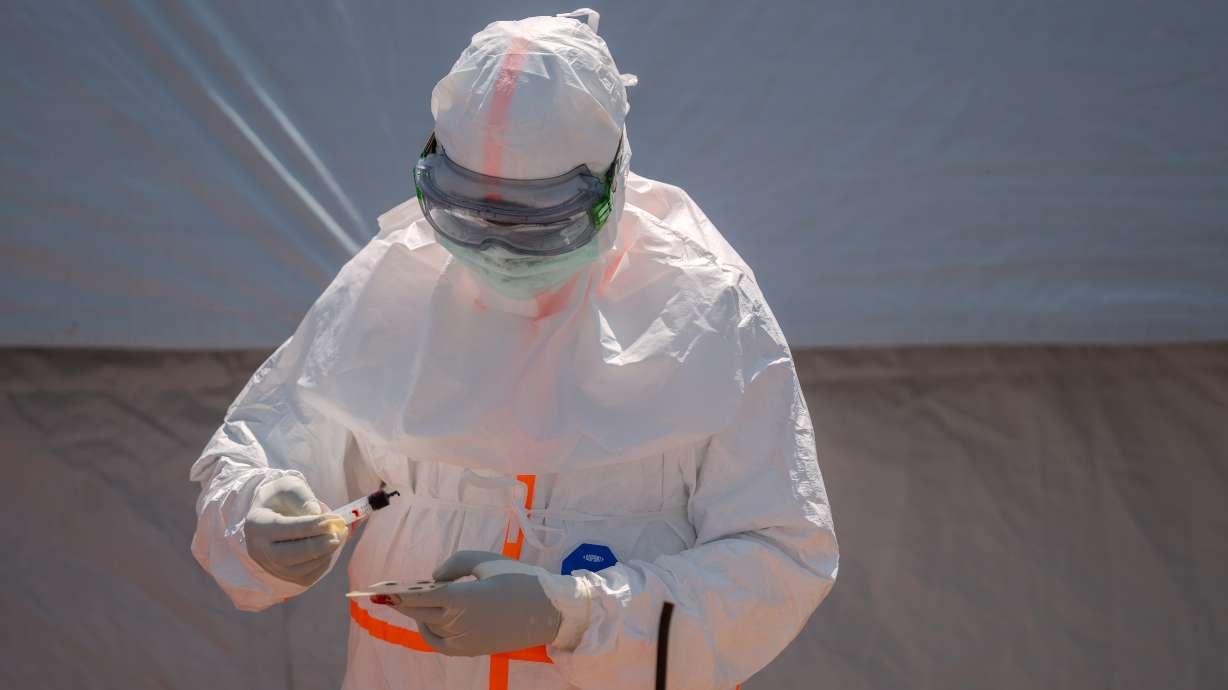 A health worker prepares a patient's blood sample for testing at Bunia General Hospital in Bunia, Congo, June 11.