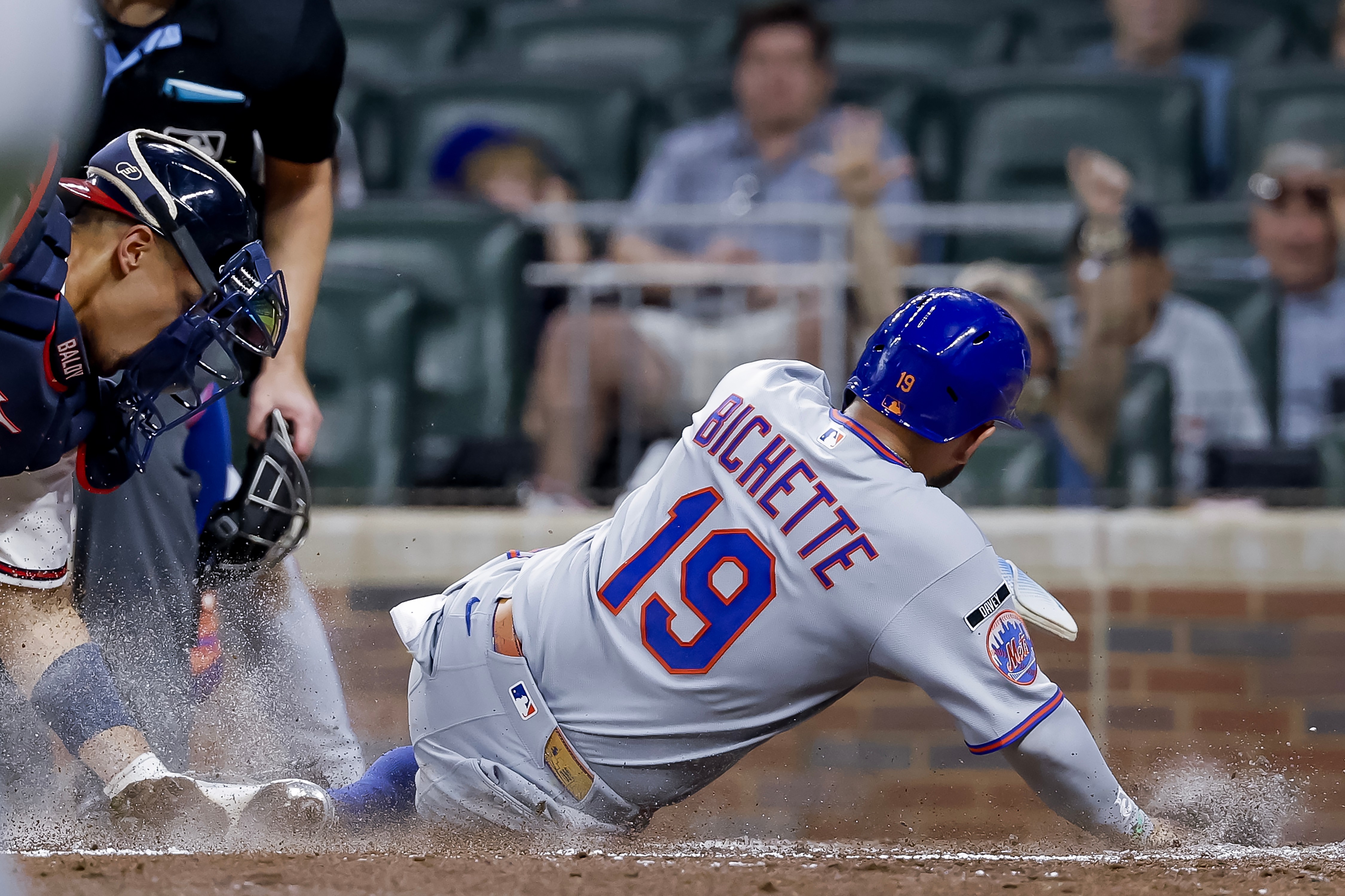 Atlanta Braves catcher Drake Baldwin, left, tags out New York Mets' Bo Bichette (19) at home plate during the sixth inning of a baseball game, Monday, July 6, 2026, in Atlanta. 