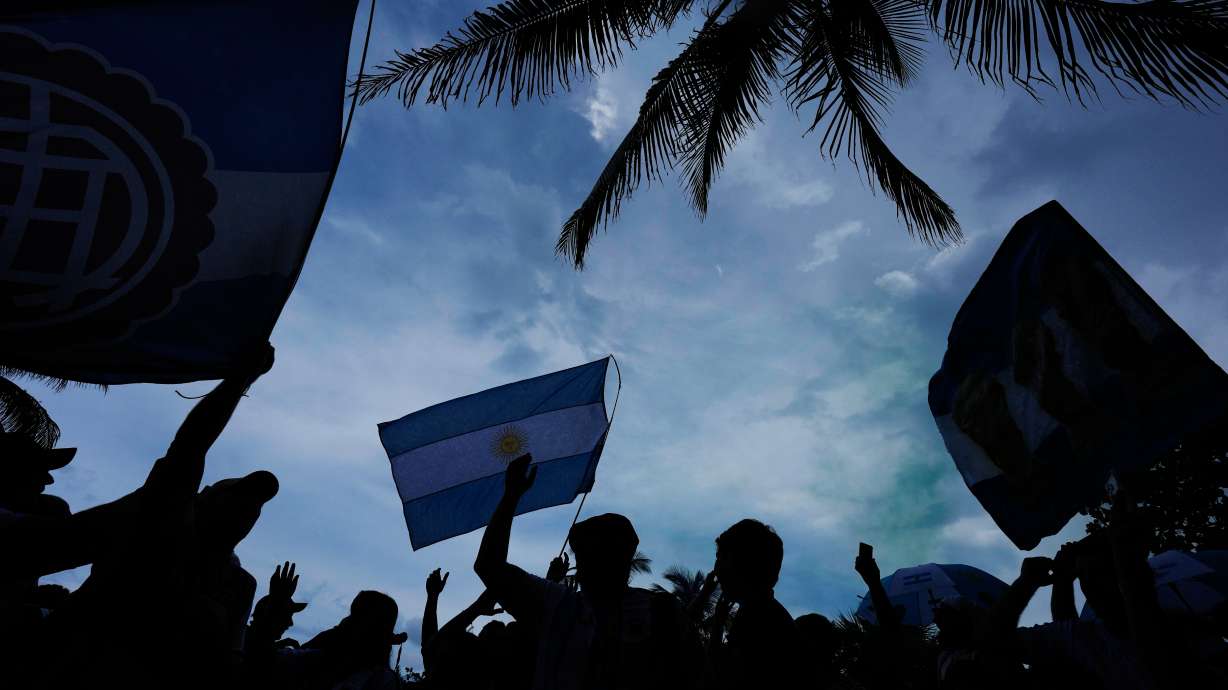 Argentina fans wave flags as they gather to celebrate and cheer on their team at a beachfront park in Miami Beach, Fla., Thursday, July 2, 2026, one day ahead of their World Cup round of 32 soccer match against Cape Verde.