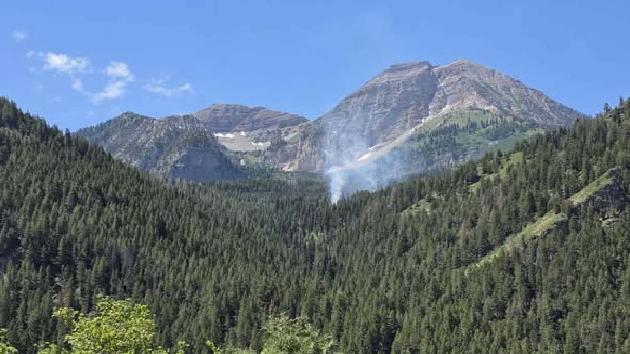 Smoke is visible from the Timp Fire, which began on July 9. A man facing multiple counts of arson says 'supernatural force' has 'control over the case,' according to court documents.