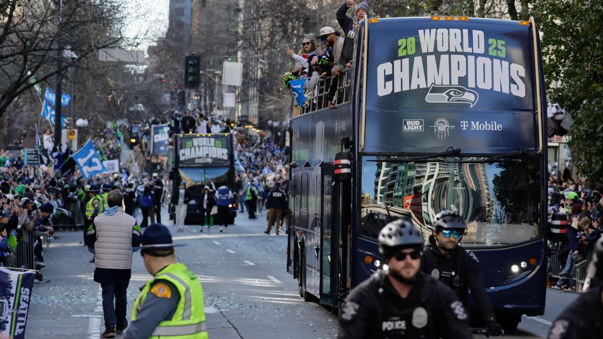 FILE - Seattle Seahawks players take part in the team's NFL football Super Bowl 60 parade and celebration, Wednesday, Feb. 11, 2026, in Seattle.