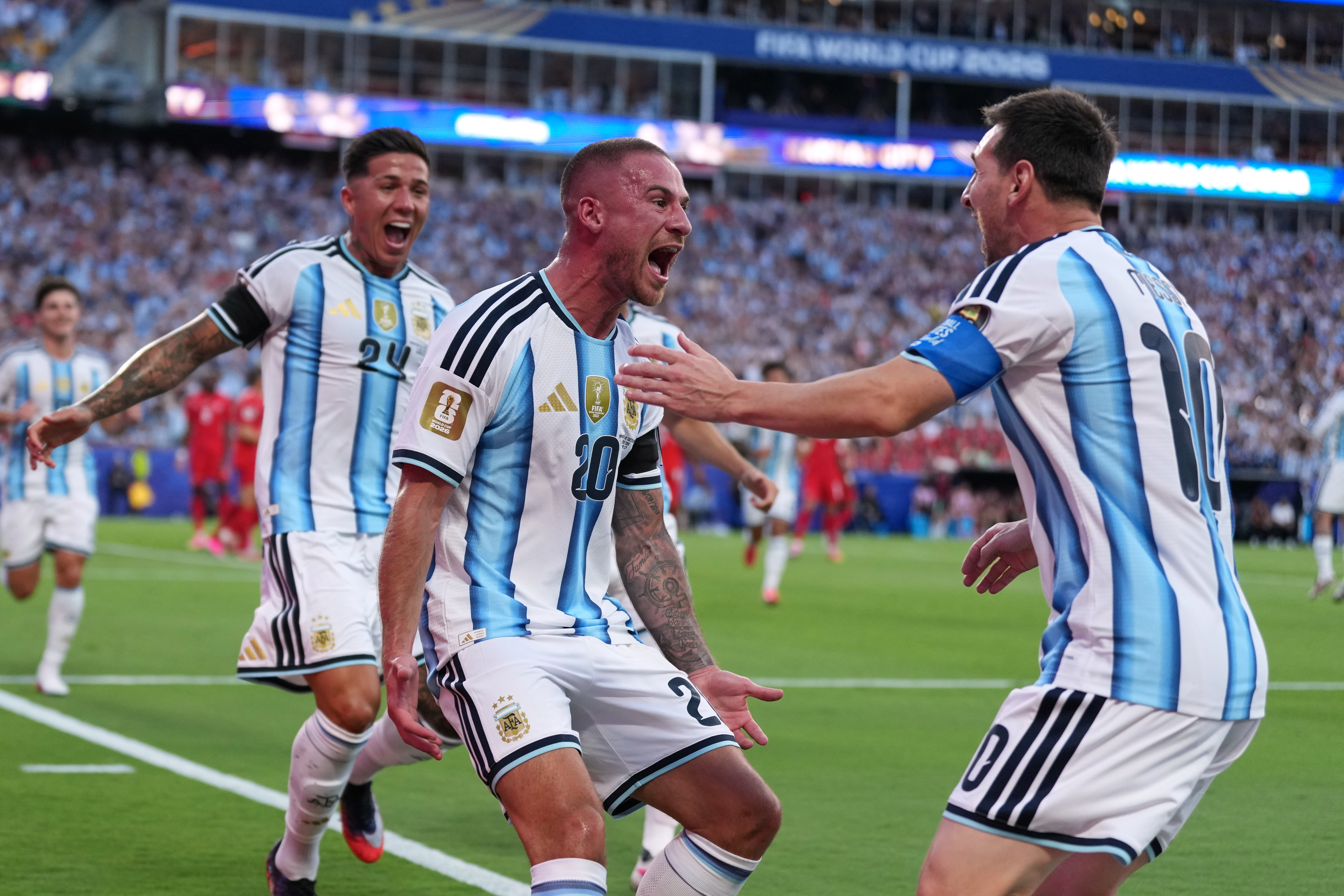 Argentina's Alexis Mac Allister, center, celebrates scoring their first goal with Lionel Messi during the World Cup quarterfinal soccer match between Argentina and Switzerland in Kansas City, Mo., Saturday, July 11, 2026. 