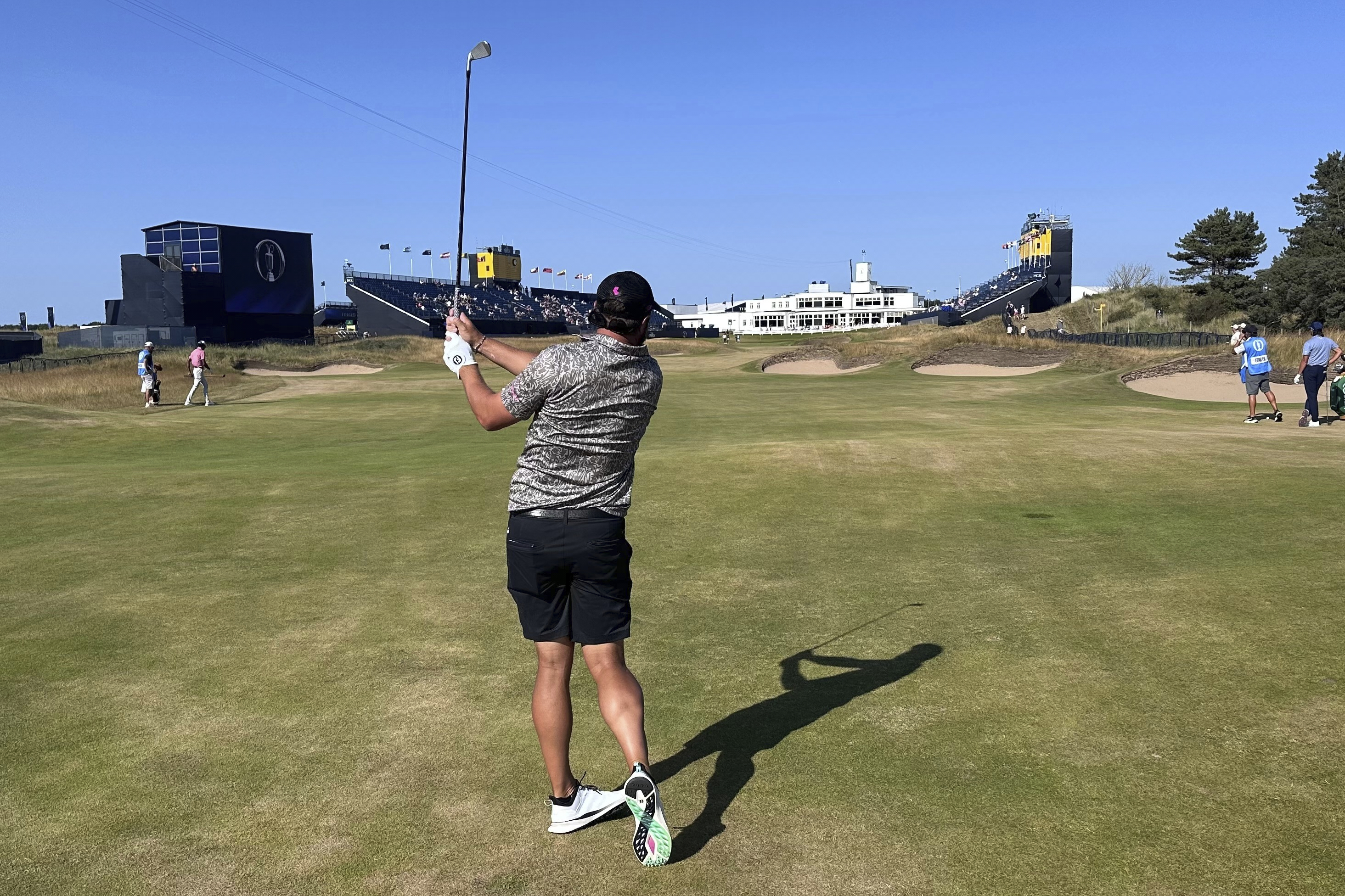 Peter Uihlein watches his 2-iron to the 18th green at Royal Birkdale on Sunday, July 12, 2026 in Southport, England, as he prepares for the British Open 