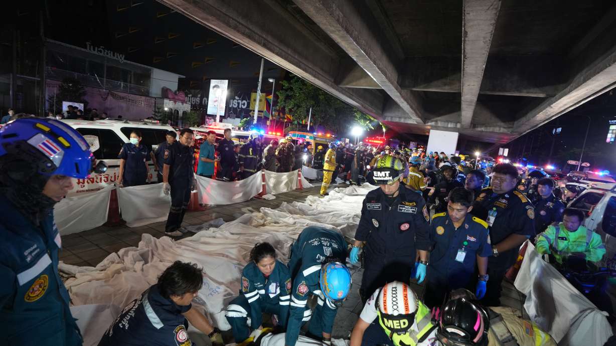 Bodies of victims of a fire are seen laid in a row in Bangkok, Thailand, on Monday.