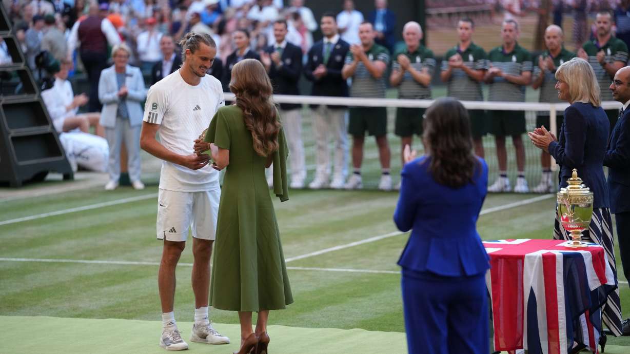 Britain's Princess Kate presents the runner-up trophy to Alexander Zverev of Germany after his match against Jannik Sinner of Italy in the men's singles final at Wimbledon Tennis Championships in London, Sunday, July 12, 2026.