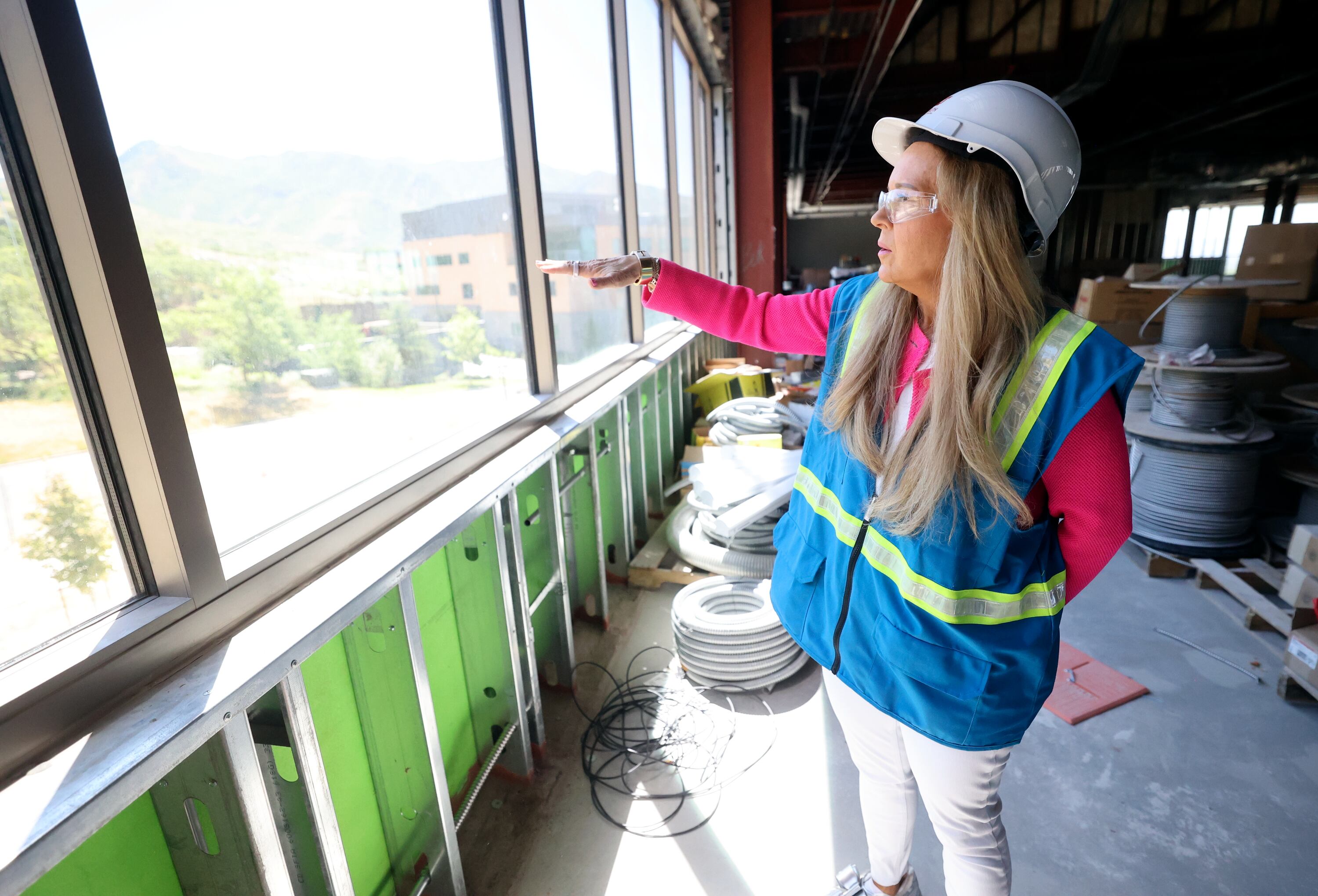 Christena Huntsman Durham, Huntsman Family Foundation director, executive vice president and vice chair, and Huntsman Mental Health Foundation CEO, looks out from the future Utah Mental Health Translational Research Building at the University of Utah Huntsman Mental Health Institute in Salt Lake City on June 18.