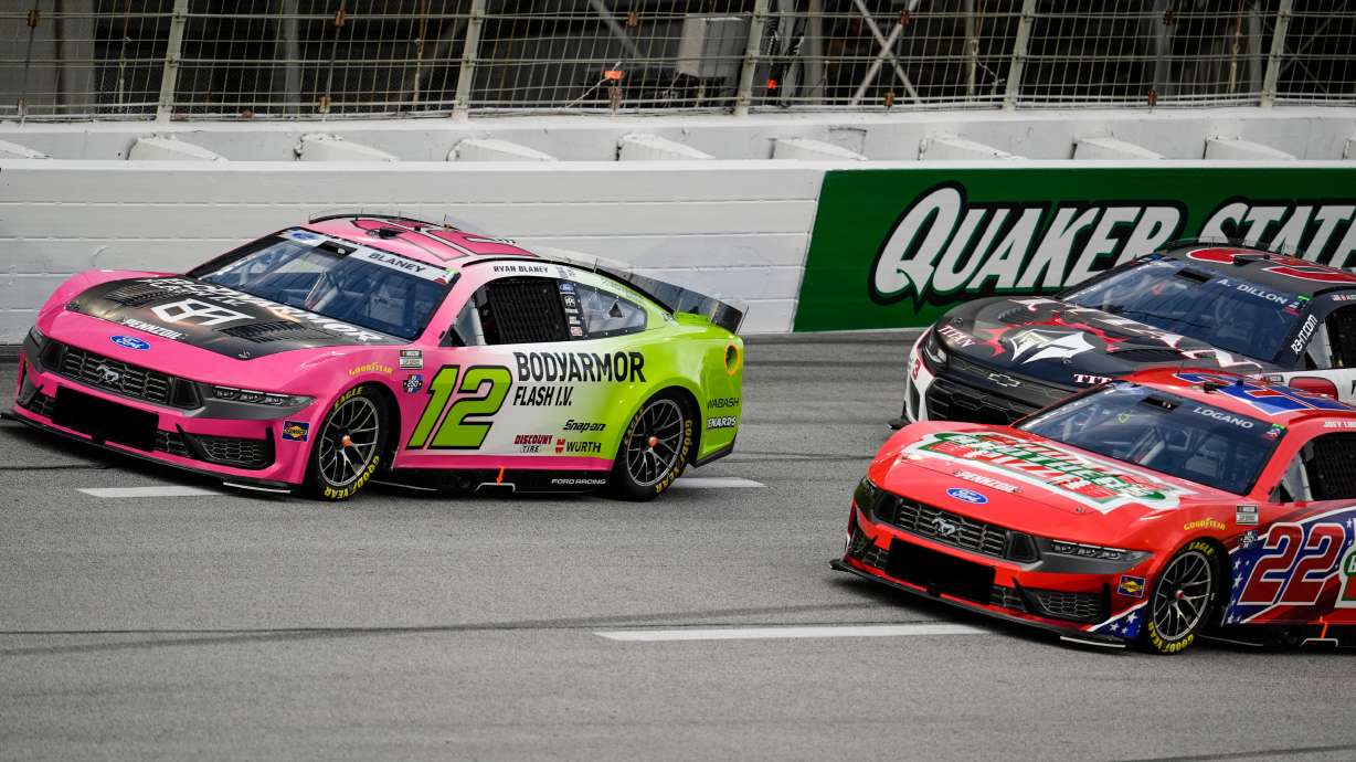 Ryan Blaney (12) and Joey Logano (22) run during a NASCAR Cup Series auto race, Sunday, July 12, 2026, in Hampton, Ga.
