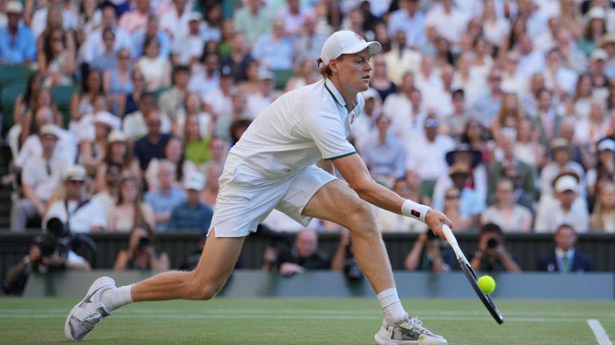 Jannik Sinner of Italy plays a return to Alexander Zverev of Germany during the men's singles final at Wimbledon Tennis Championships in London, Sunday, July 12, 2026.
