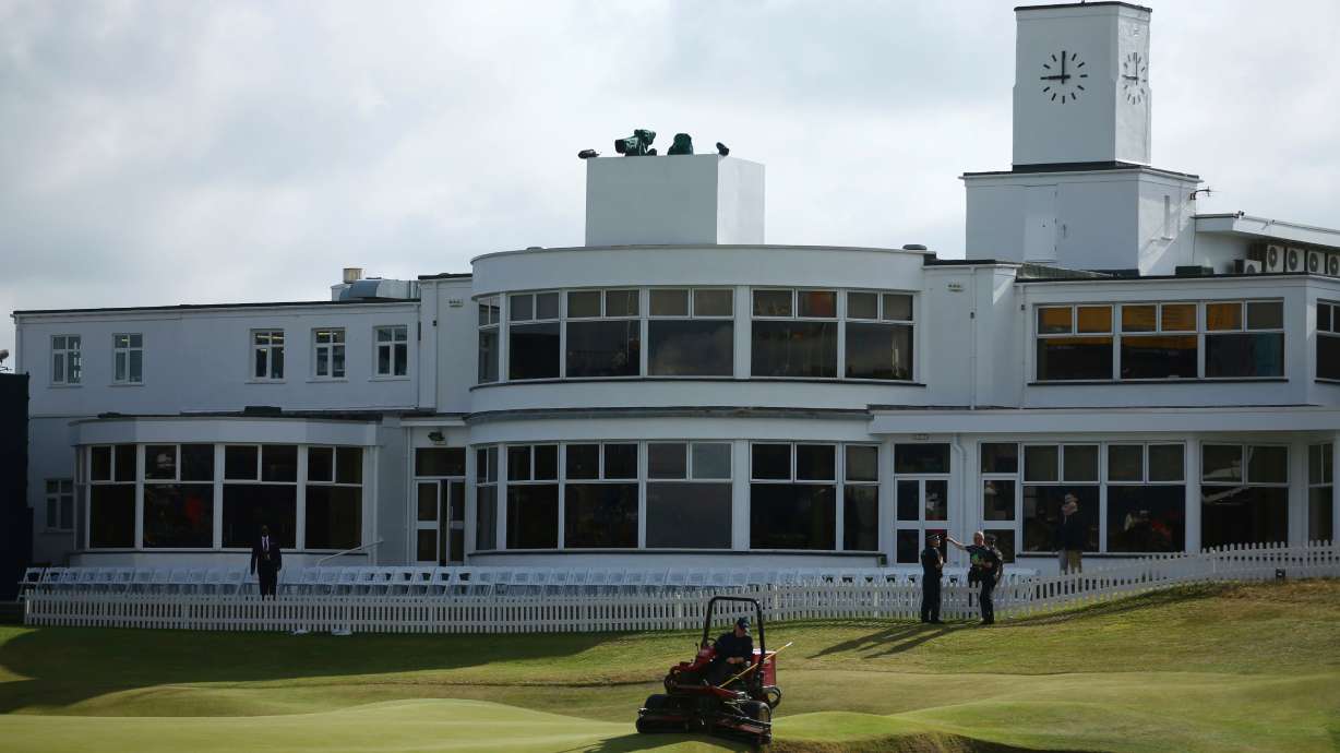 FILE - A groundsman prepares the 18th green ahead of the final round of the British Open Golf Championship, at Royal Birkdale, Southport, England, Sunday July 23, 2017.