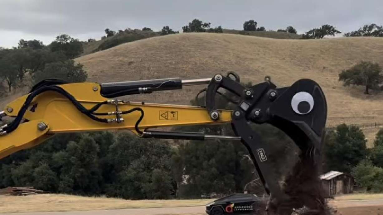 A man put googly eyes on construction equipment to imitate dinosaurs.