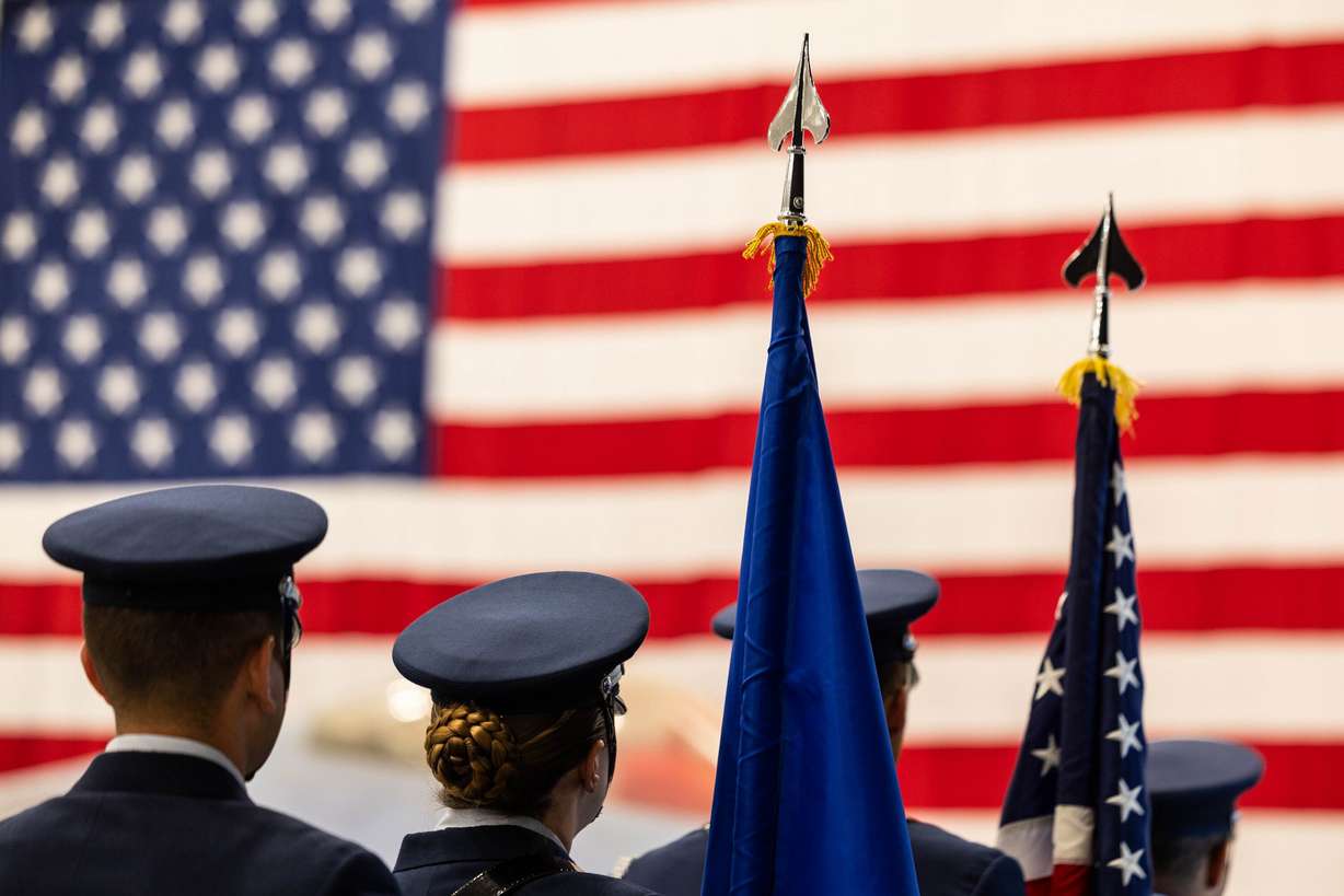 The color guard prepares to walk toward the stage during a change of command ceremony at the Hill Aerospace Museum on Monday.