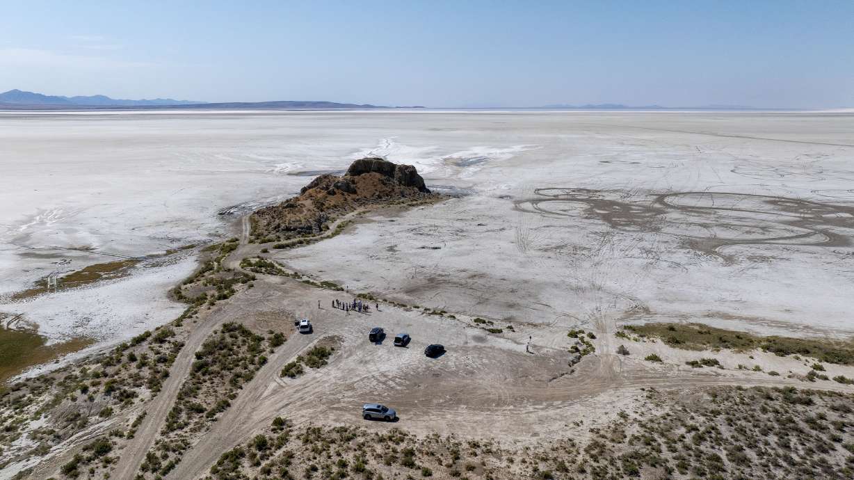 The photo shows Lone Rock in the bed of the Great Salt Lake on Monday. Lake water used to surround the rock, a stopping point on a tour of the area on Monday led by opponents of the proposed Box Elder County data center proposal.