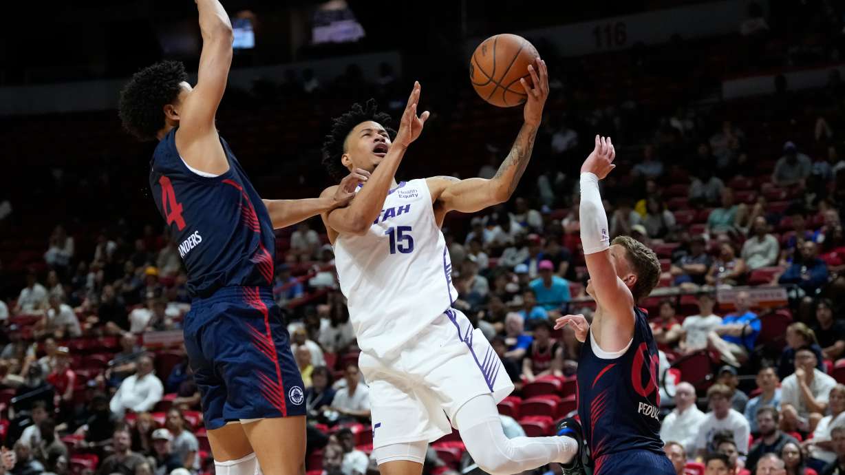 Utah Jazz's Trey Alexander shoots against LA Clippers' Kobe Sanders, left, and LA Clippers' Sean Pedulla during the second half of an NBA Summer League basketball game Sunday, July 12, 2026, in Las Vegas.