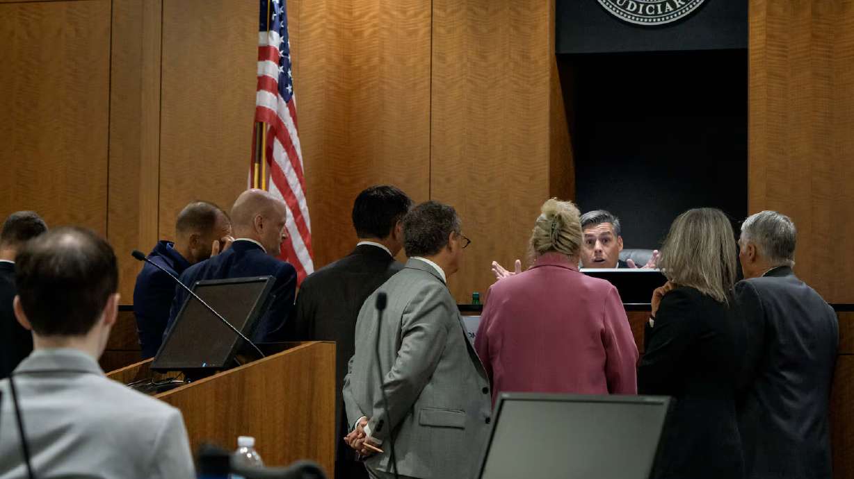 Tyler Robinson, left, who is accused in the fatal shooting of Charlie Kirk, sits while Judge Tony Graf confers with attorneys during his preliminary hearing at the 4th District Courthouse in Provo.