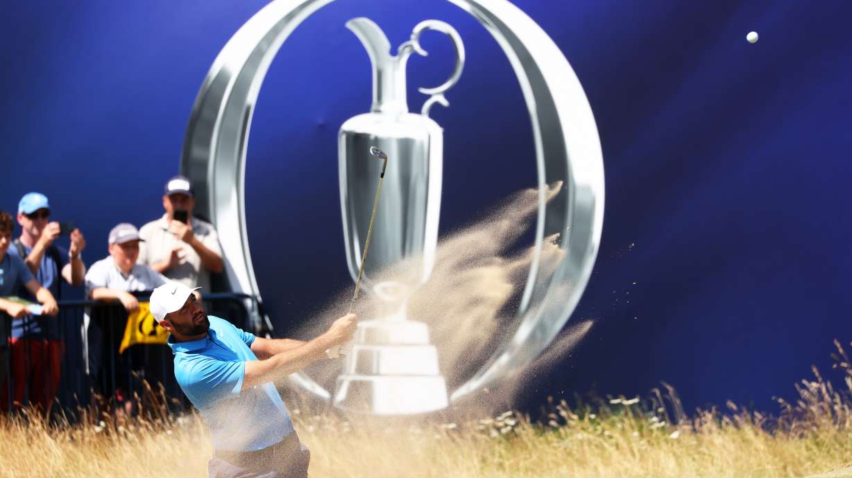 US golfer Scottie Scheffler plays out of the bunker during a practice round at the British Open Golf Championship at Royal Birkdale, Southport, England, Monday, July 13, 2026.
