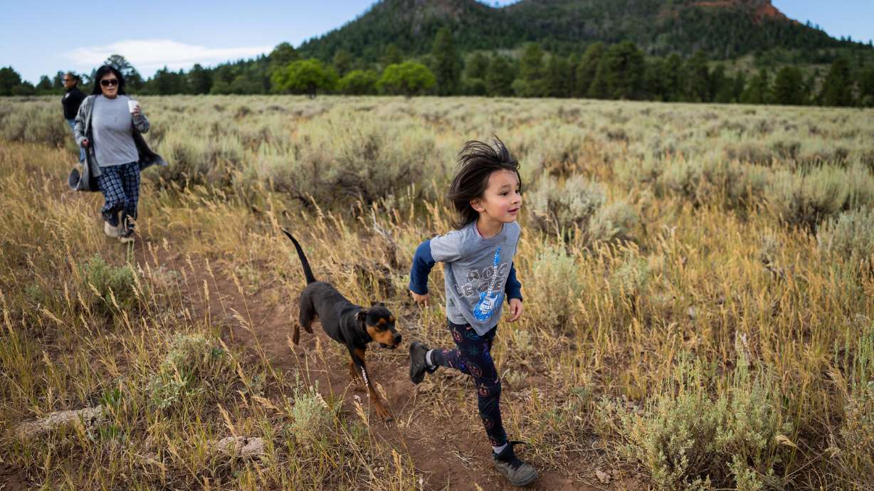 Tavithen Jones, 6, a Navajo from Cortez, Colorado, at the Kagalia Guard Station Campground during the Bears Ears Summer Gathering on July 27, 2025. Tribal leaders say they were not consulted before the size of the monuments were reduced by federal executive orders.