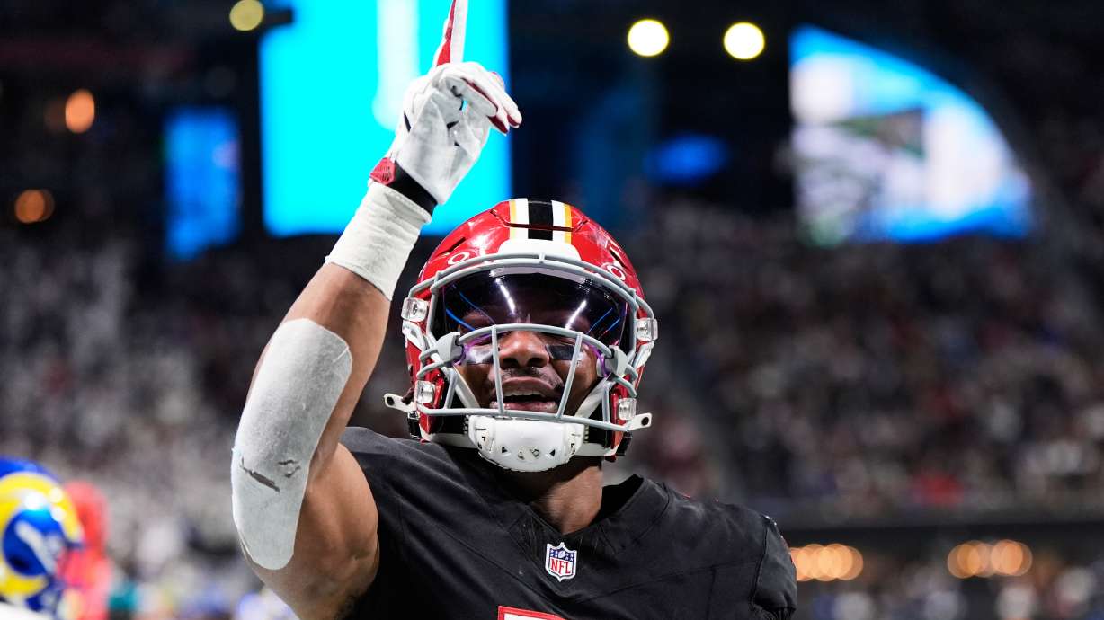 FILE - Atlanta Falcons running back Bijan Robinson (7) celebrates his touchdown reception against the Los Angeles Rams in the first half of an NFL football game, Dec. 29, 2025, in Atlanta.