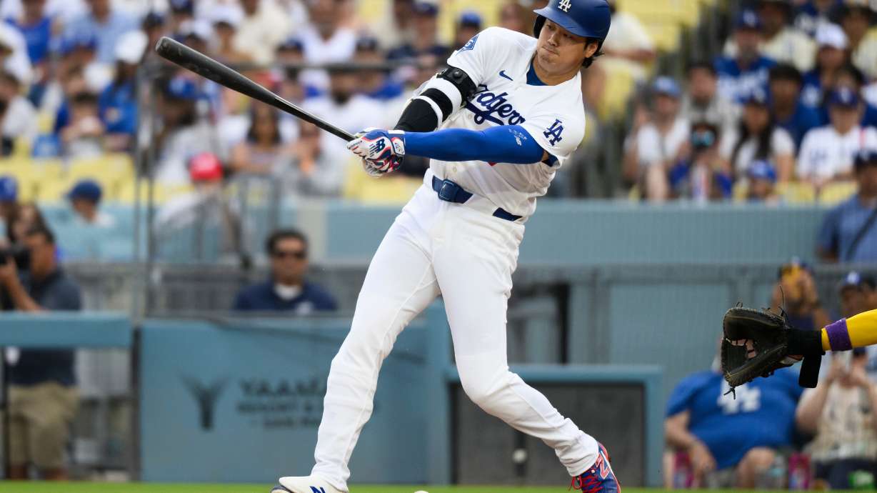 Los Angeles Dodgers' Shohei Ohtani hits a ground ball during the fifth inning of a baseball game against the Arizona Diamondbacks in Los Angeles, Sunday, July 12, 2026.